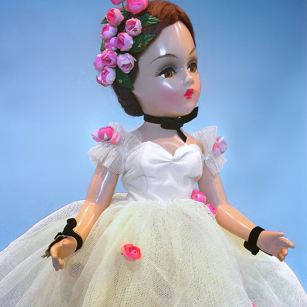 Sleeper eye doll with hand embroidered ball gown