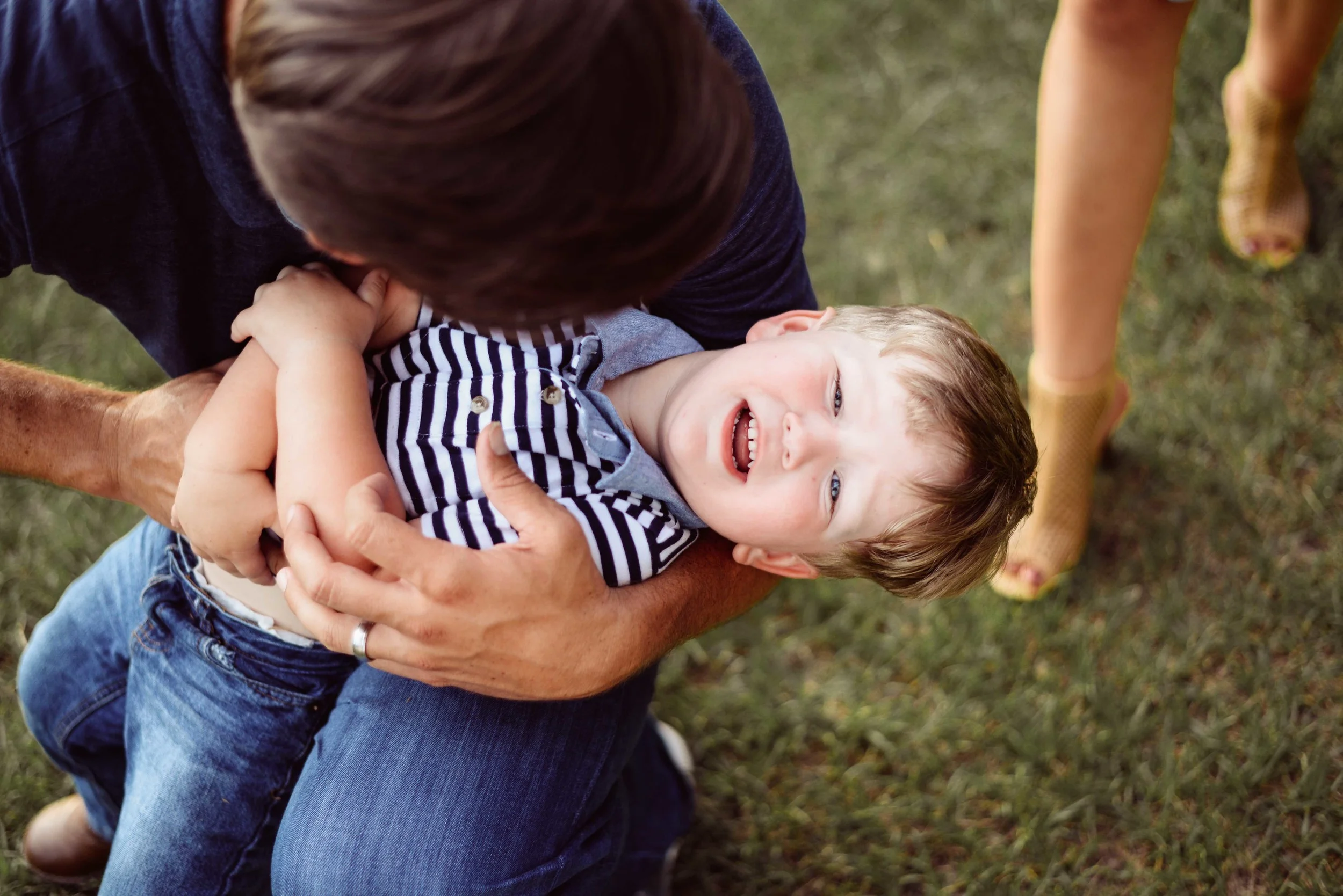 dad tickling son