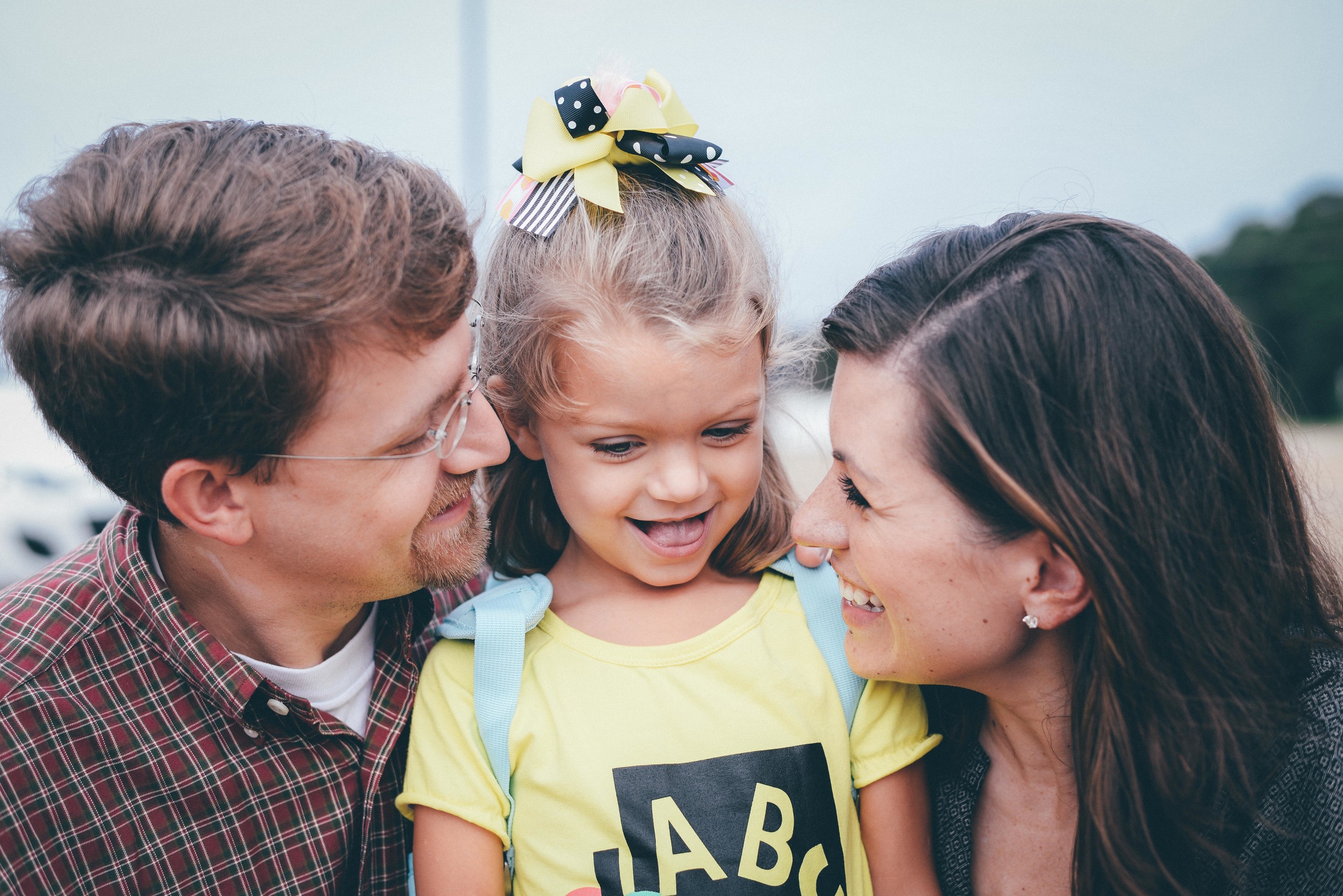 family smiling on first day of school