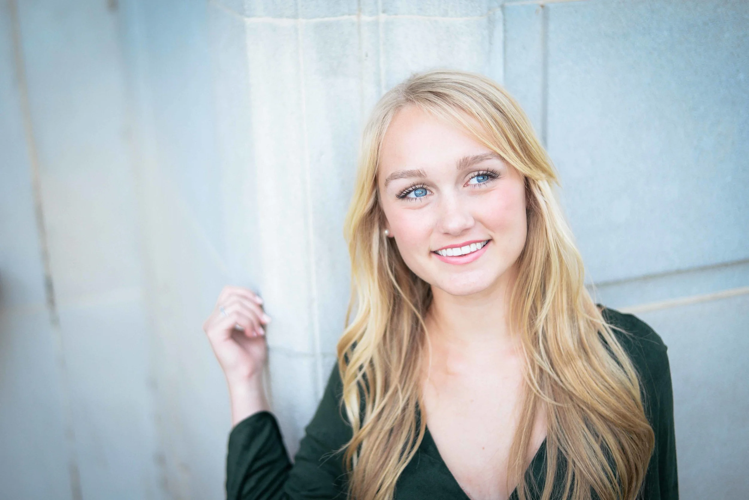 girl leaning against wall