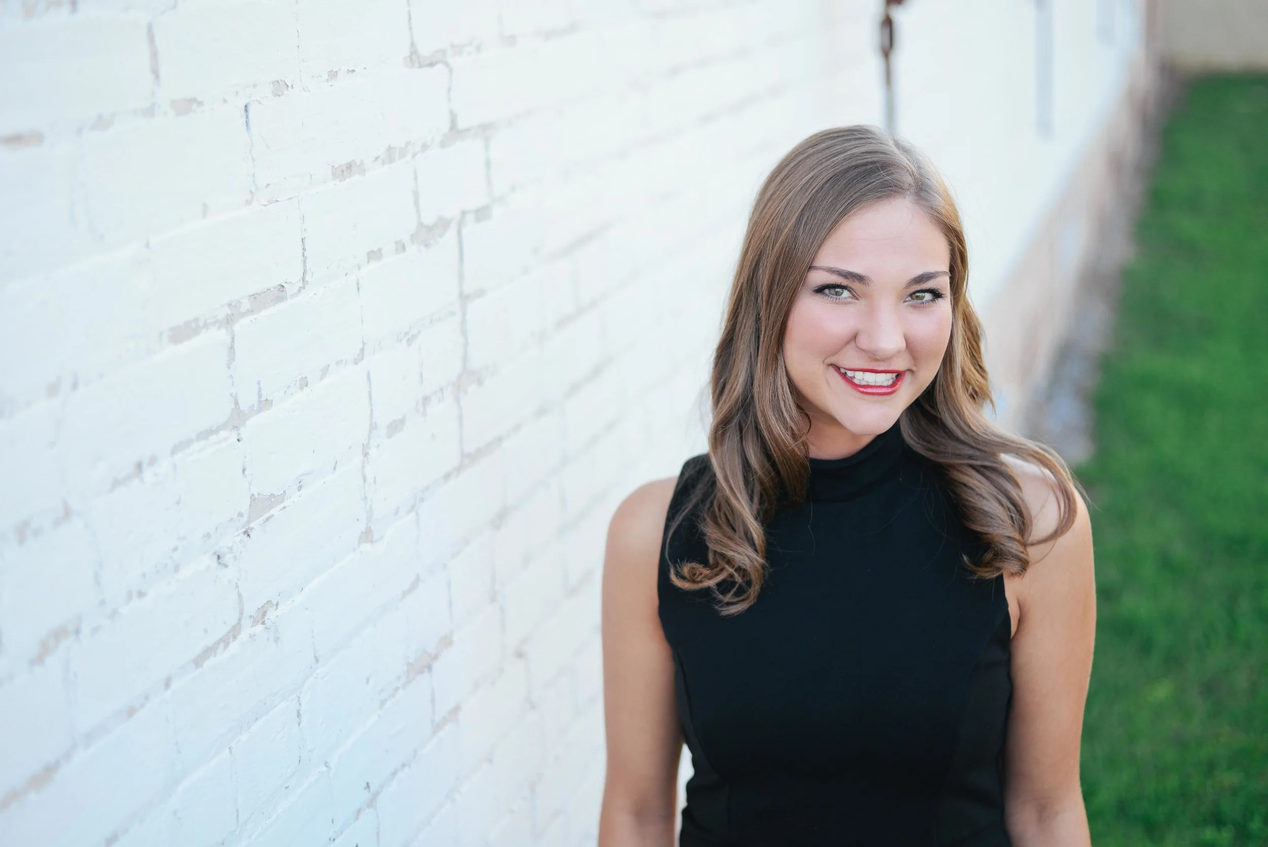 senior photo against white wall