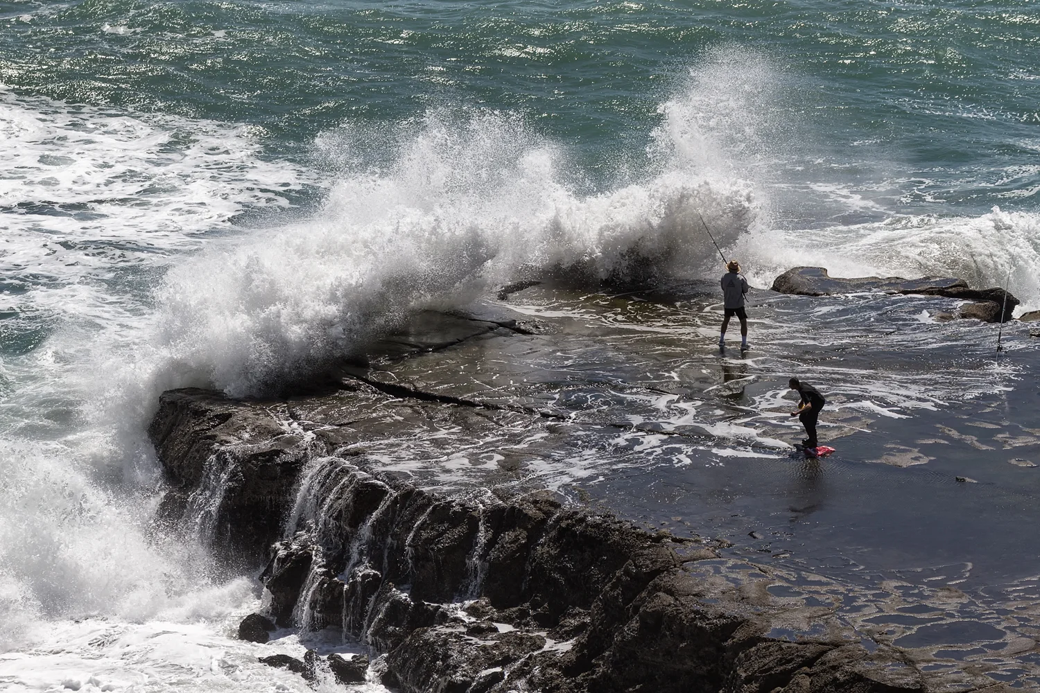 Fishermen risking life and limb.