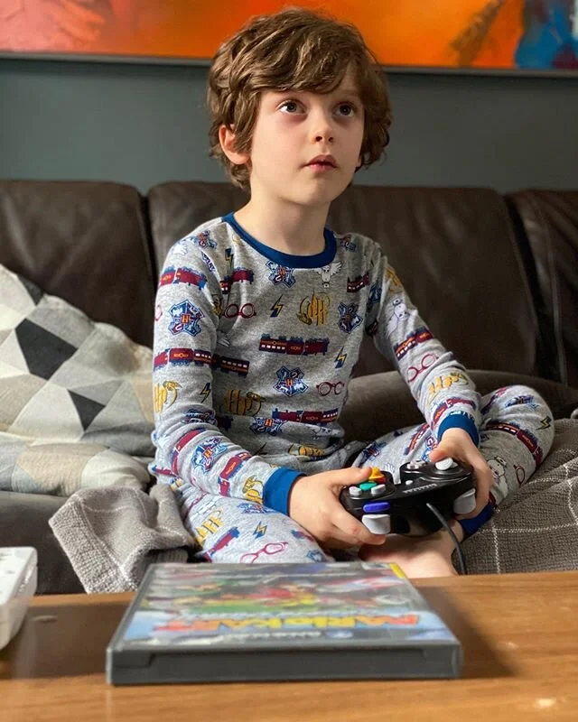 Showing Desmond Mario Kart: Double Dash... then we got to Rainbow Road.