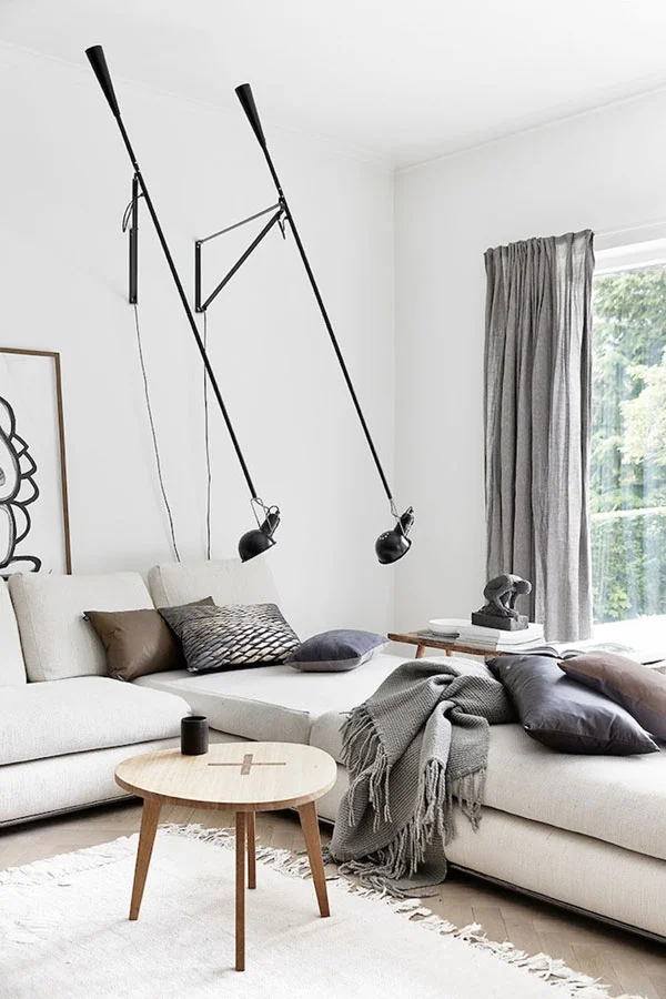 I'm really digging black and white lately. But these wall-mounted lamps (above) scare me to death. I see two giant praying mantis. Even the sculptural man is cowering in fright. Photo by Johanne Dueholm. Purchase the insect lighting here .