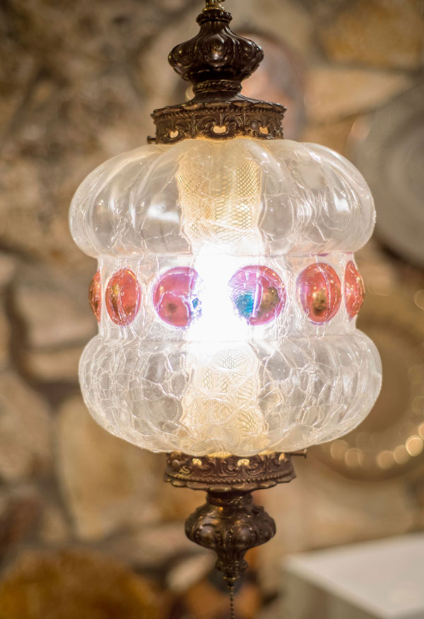 A midcentury modern hanging light fixture that lends a gypsy touch. I found it languishing in a second hand shop.