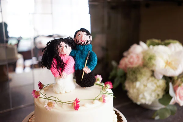 There they are! My finger puppet bride and groom sitting sweetly atop a vegan wedding cake! The woman who knit them for me is a blog subscriber and I think she is shocked at how far I have taken this gag. #fingerpuppets #onfleek