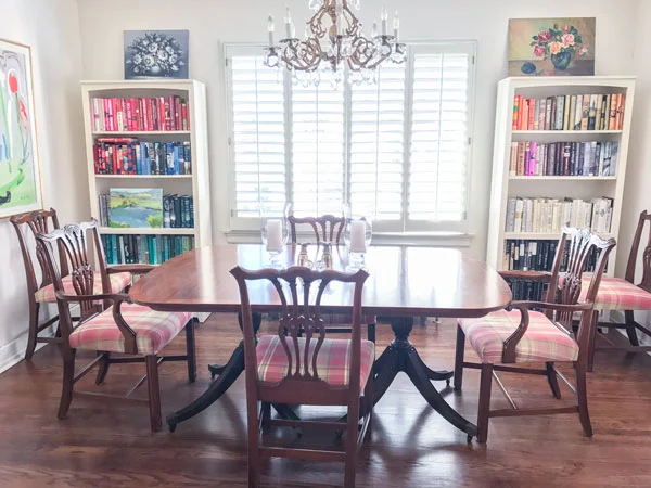 A dining room doubling as a library, which is as it should be. Also, Margaret sorts her books by color, a fun trend that causes pain to certain individuals who prefer their books sorted by author. To them I say it won't kill you to browse through your own stacks.