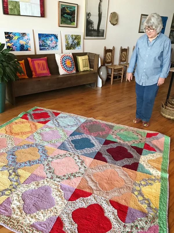 Cathy purchased this "hearts and gizzards" piece unfinished on eBay. It took her two years to hand quilt it. I asked Cathy why she feels compelled to finish a long-dead stranger's quilt when she has so much modern quilting of her own to do. "I love the history and the mystery," she said. "I want to honor their work by completing the piece. And I'm a process person. I'm not in a hurry."