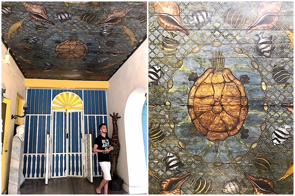 Frederic built the roof of the loggia using a piece of mahogany that washed ashore. He painted the sea turtle, the shells, and the fish. The tour guide pointed out that Evelyn had the unenviable job of painting the netting.