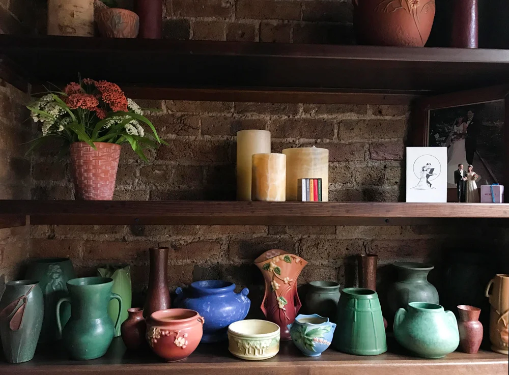 Mike and Harlene lived in an arts and craft bungalow in Oak Park, Illinois, where everything was oak oak oak. Harlene avoided oak accents in their loft apartment but their collection of Roseville and Ephraim Faience pottery made the cut to the Big City.