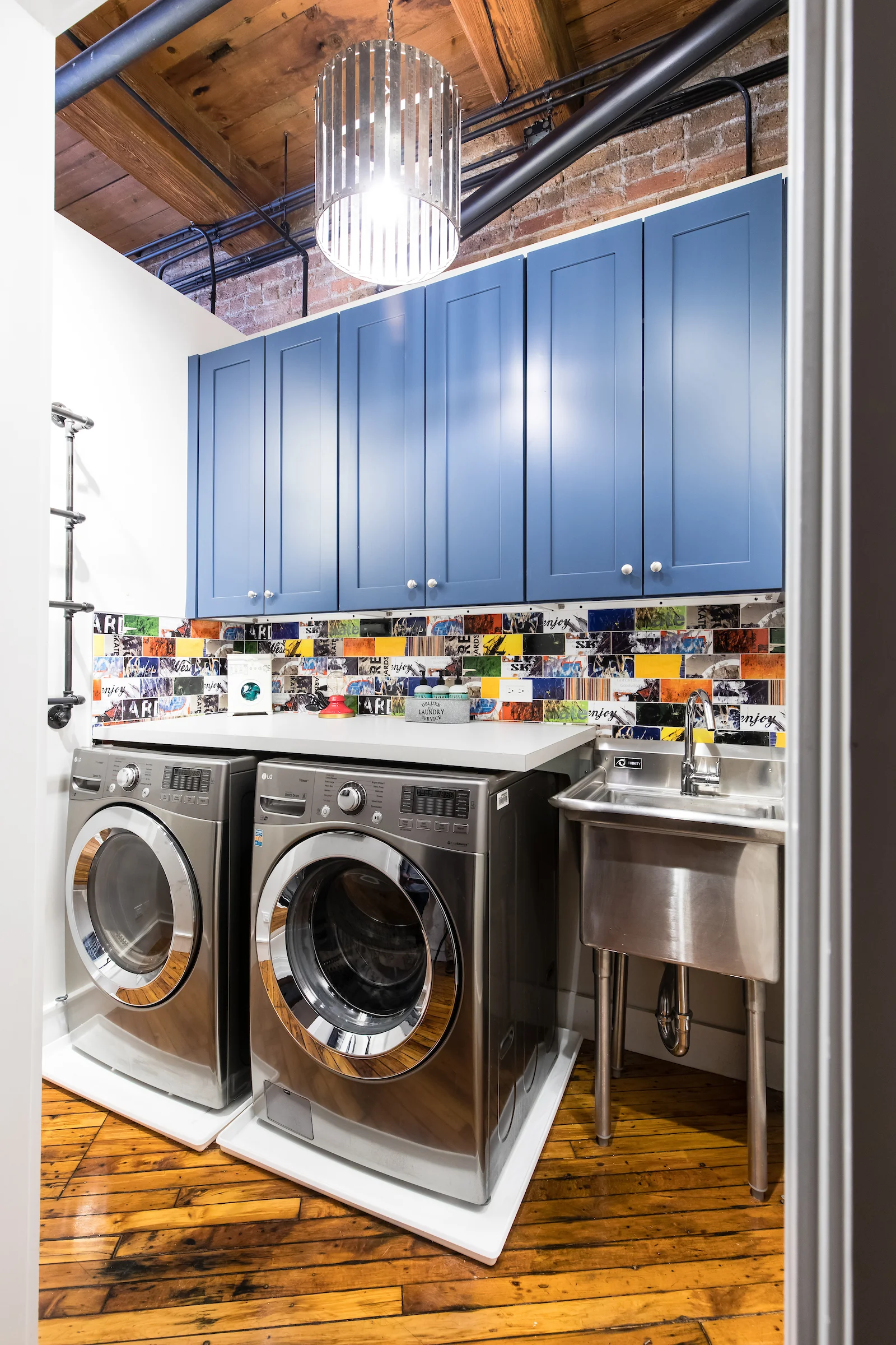 There is a place for everything, and everything in its place. And no space is without art. Here, in the laundry room, the wall tile, images of skateboards, provides a vista to gaze upon while folding towels.