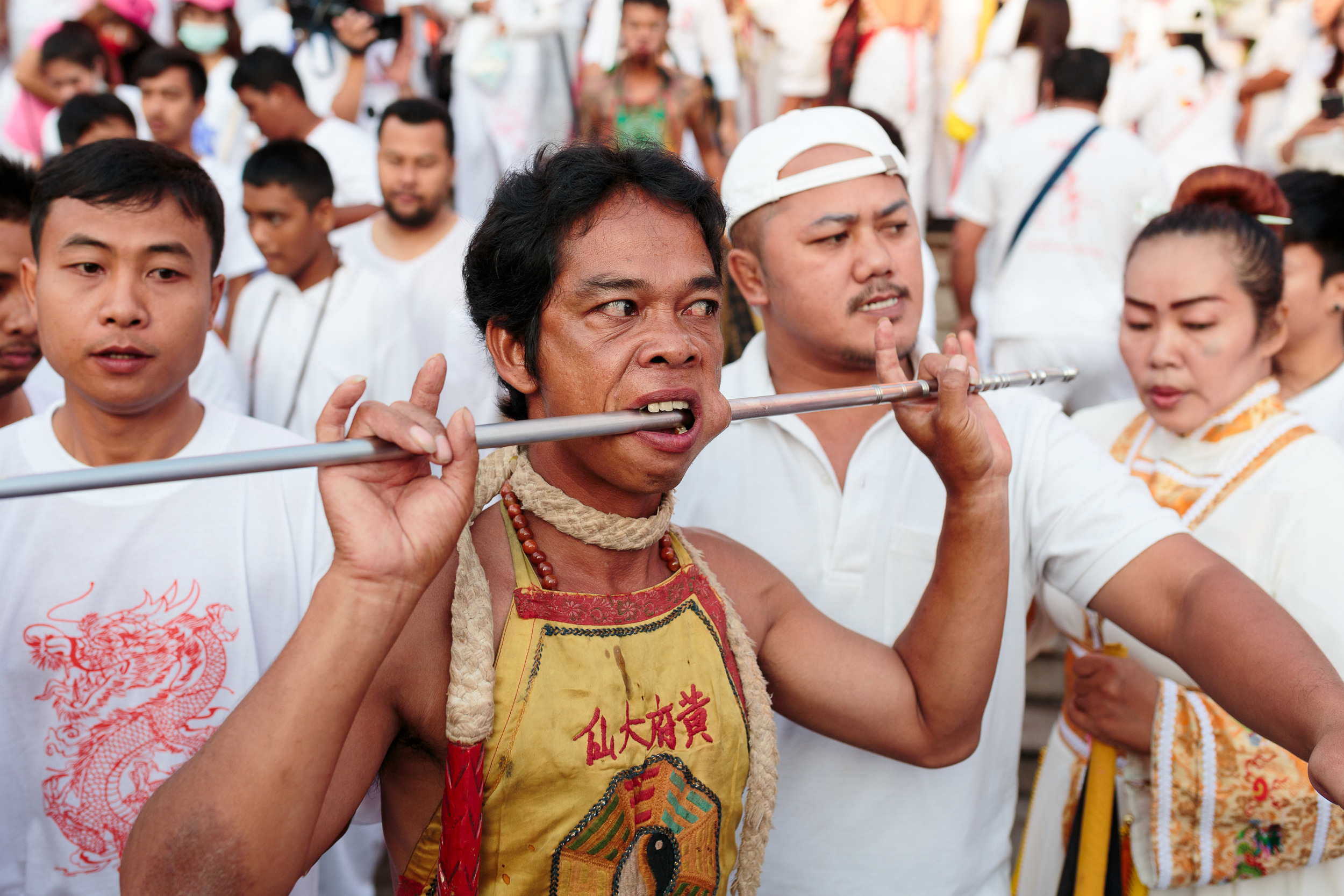 Many people go into a trance, and get pierced with symbols ranging from spikes and swords to household items like wrenches. 