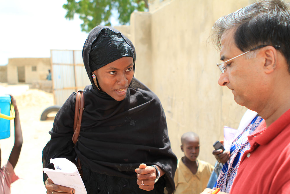  A polio vaccinator definitely knows her stuff, as she explains her work to my colleague Shahzad. &nbsp; 