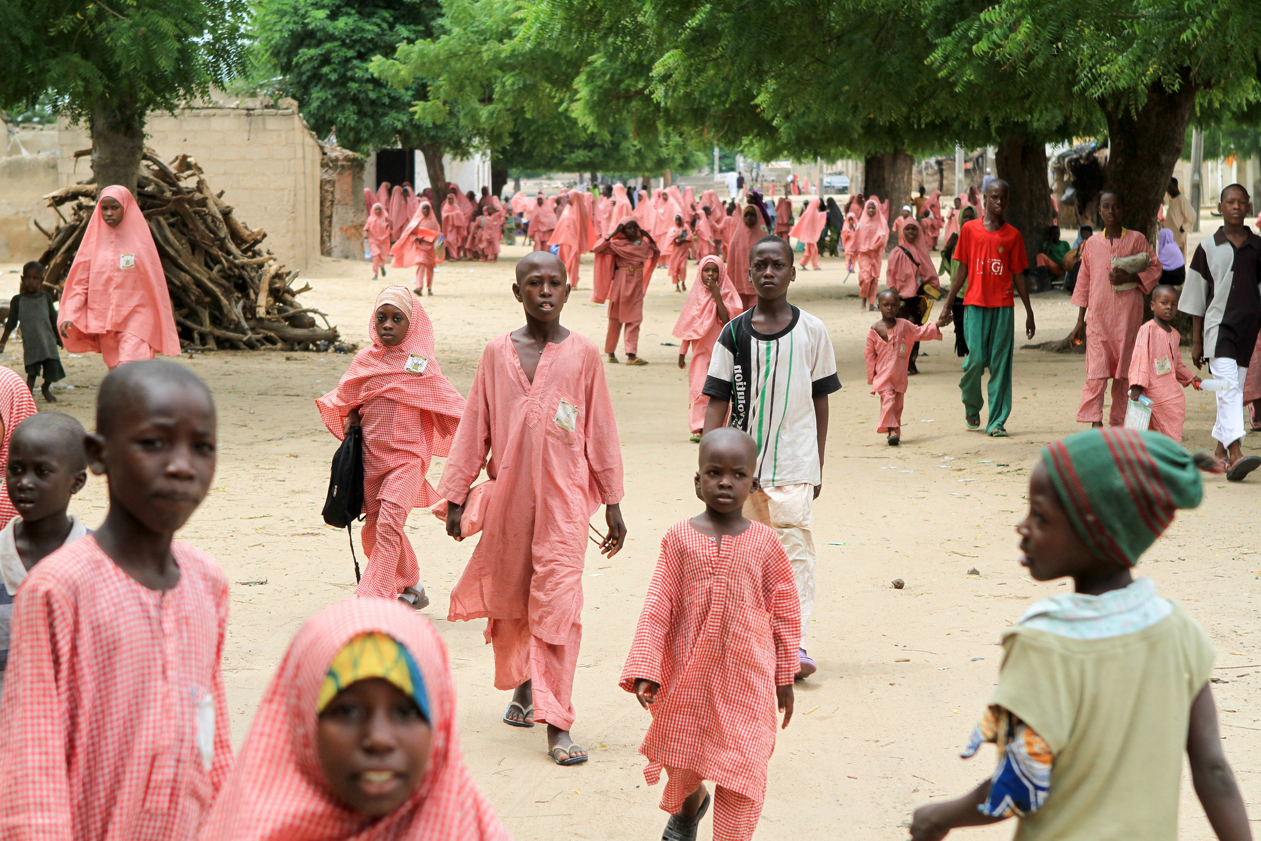 I'll never forget this sight of the red uniforms and the green trees in the sunshine. 