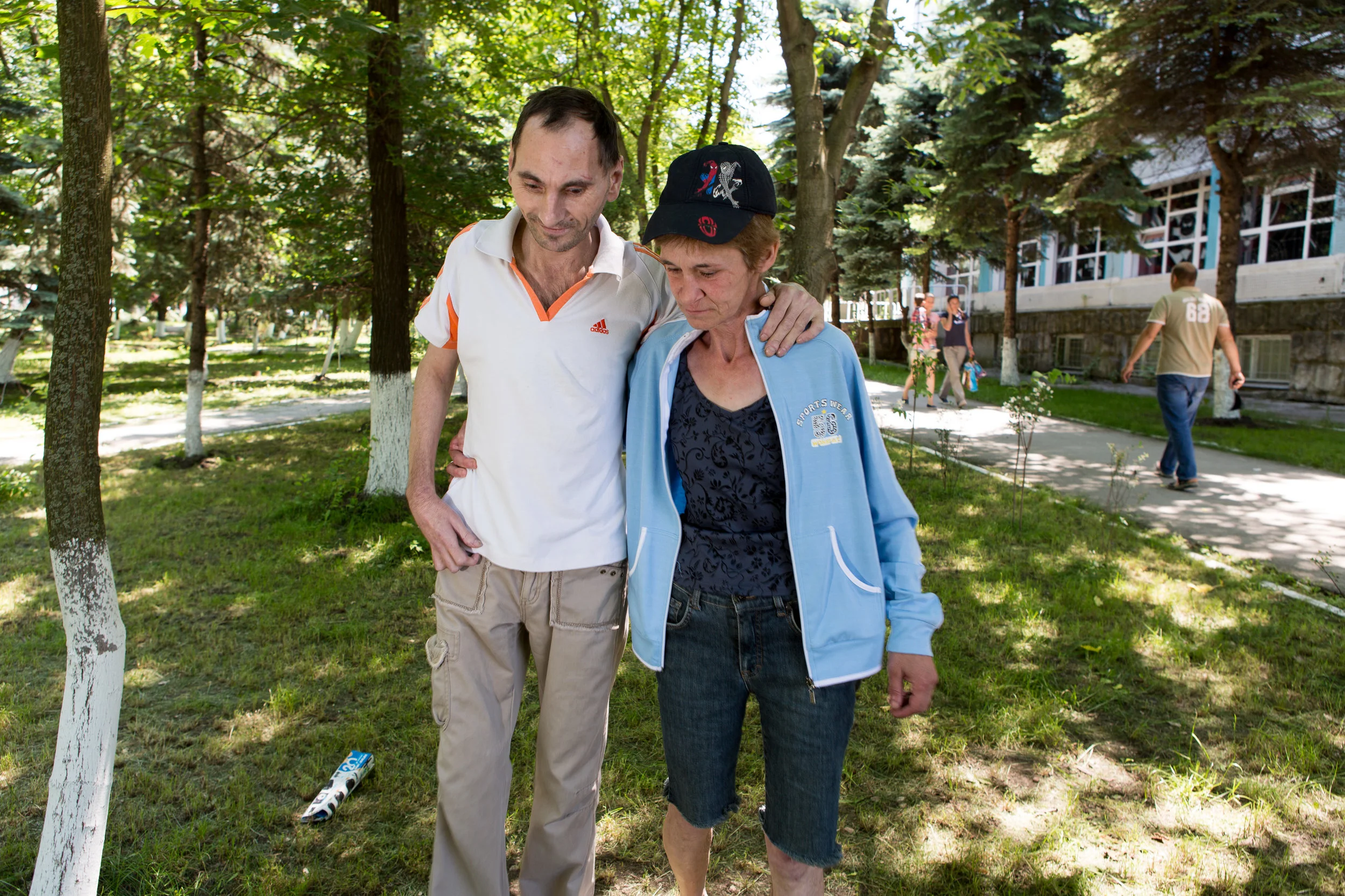 Ludmilla helps her friend Sergei to walk. They both had TB, and stood by one another as they finished their treatment. "When you're sick and alone, the support is so important." 
