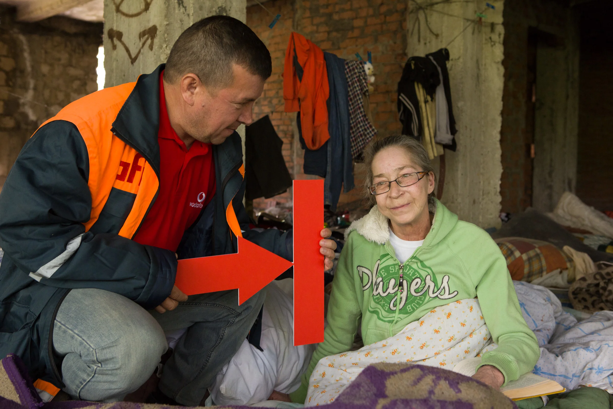 Dr. Valeriu Coada and Katerina. Valeriu holds the Stop TB Partnership symbol. 