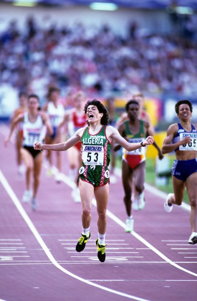 Under intense pressure and facing death threats from Islamist radicals, Boulmerka became the first Algerian woman to win an Olympic title at the 1992 Olympics in Barcelona. In the lead up to the Olympics, Boulmerka was forced to train in Berlin due to the militant uprising in Algeria: "It was too risky. I could have been killed at any moment". Boulmerka later served on the Athlete's Commission of the International Olympic Committee (IOC). 