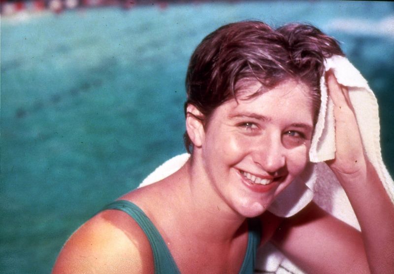 Dawn Fraser is regarded as the finest female sprint swimmer of them all; winner of four gold and four silver Olympic medals, holder of 39 world records. Just six months before the 1964 Tokyo Olympics, Fraser was driving a car when it crashed. Her 60-year-old mother, Rose, who had been sleeping in the backseat, was killed. she went to Tokyo in 1964 and won her third consecutive gold medal for her late mother. Wearing her mother's wedding ring, she stood by the pool and sobbed. Then she started blasting on a bugle while poolside, marching at the wrong time, and trying to steal a flag from the Emperor's palace (a jailable offence). The Japanese authorities and Australian public forgave her (she was made Australian of the Year in 1964), but, in a very unpopular move, the Australia Swimming Union banned her from swimming for a decade. Fraser has since remarked that she was banned for wearing a comfortable but unofficial swimsuit (that she had stitched herself) in the Olympic opening parade and one of her heat races, because the official uniform swimsuit was ill-fitting. She now co-manages a cheese shop and pub with a woman with whom she has been in a long-term relationship.