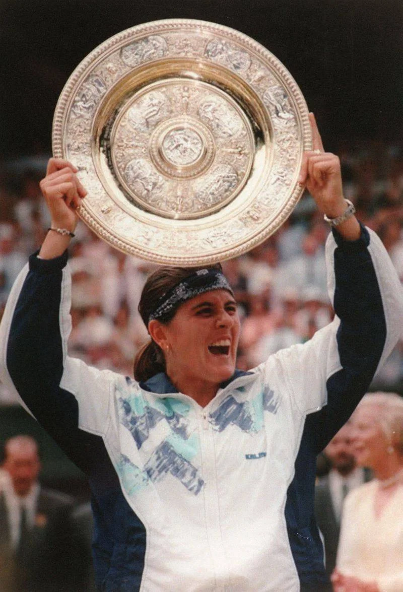 The only Spanish woman to win the women's singles title at Wimbledon, Martinez defeated Martina Navritalova to take the crown in 1994. Martinez has won three Olympic medals in doubles competition and holds the record for most professional tournament wins by a Spanish female tennis player. Although she never formally came out, Martinez's relationship with fellow tennis players Gigi Fernandez and Patricia Tarabini were widely known. Martinez is currently the captain of the Spain Fed Cup team. 