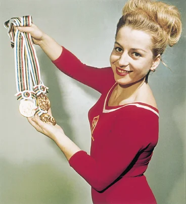 Czech gymnast Vera C áslavská dominated the sport during the 1960s, winning seven Olympic gold medals in individual events. She is the only gymnast, male or female, to have won gold in each discipline. A vocal supporter of the Czech democratic movement, C áslavská opposed the Soviet influence on her home country, often looking away when the national anthem was played at events. As a result of her outspoken stance, the new Soviet regime barred her from travelling or attending sporting events, effectively forcing her into retirement. The ban was later lifted with the help of the IOC and C áslavská went on to hold several distinguished positions, including President of the Czech Olympic Committee.