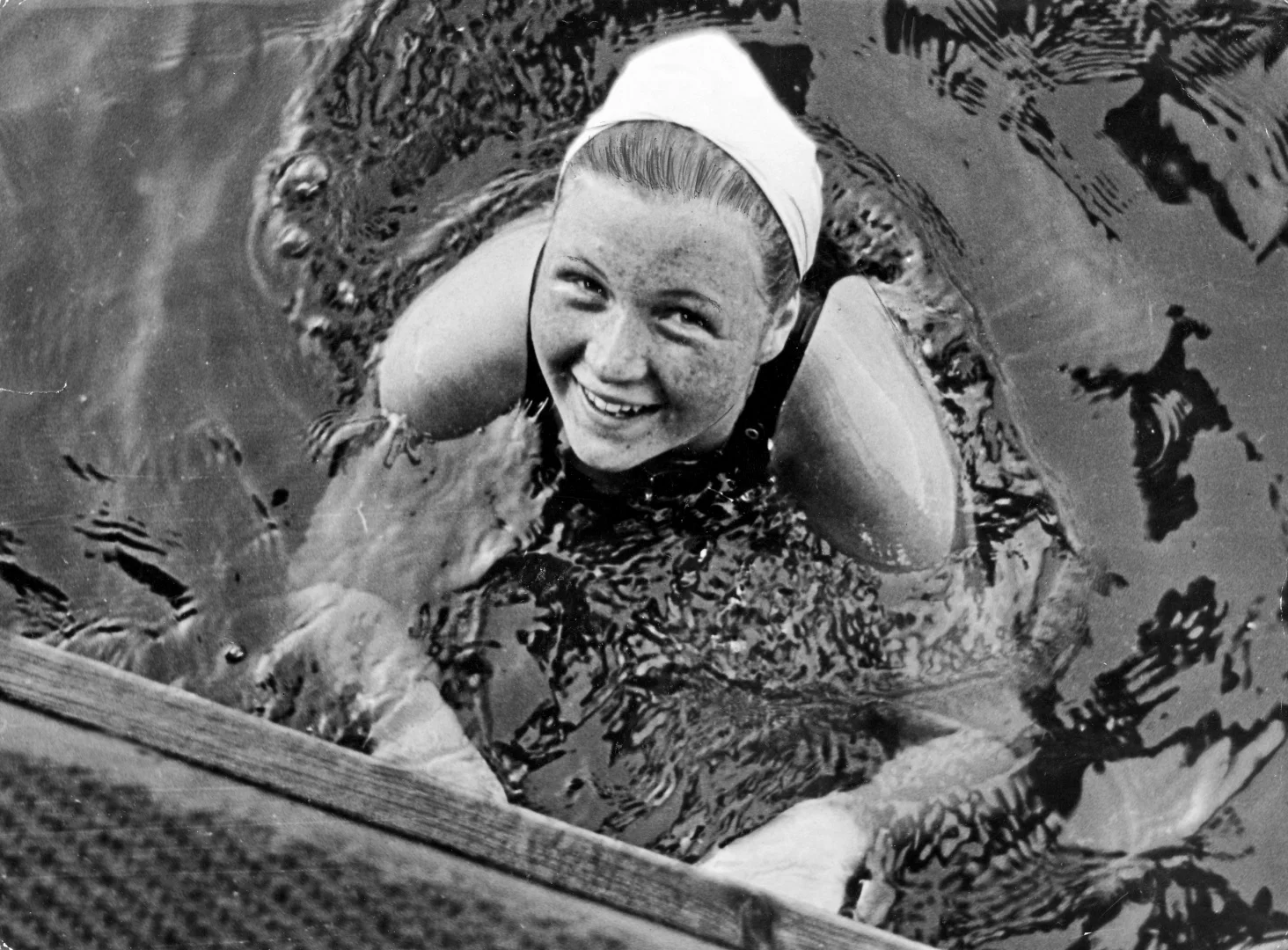 The youngest female swimmer to win an Olympic medal, Danish-born S ørensen took home bronze at the 1936 Olympics. Standing on the podium in Berlin, Sorensen made waves of a different kind when she refused to salute to Hitler. S ørensen was dubbed "Little Captivating Inge" and feted by 30,000 Danish supporters upon arriving back in Copenhagen. Following the Nazi occupation of Denmark in the early 1940s, the image of S ørensen refusing to heil Hitler became a moving symbol of Danish resistance. After taking a swimming instruction course at age 20, it was determined that S ørensen had violated the amateur rules and was barred from competing in amateur athletics. Sorensen moved to Sweden where she coached the national team to victory in 1945. Settling in the US with her husband in the 1950s, Sorensen made three return visits to Denmark, each time travelling the Atlantic in her own boat.