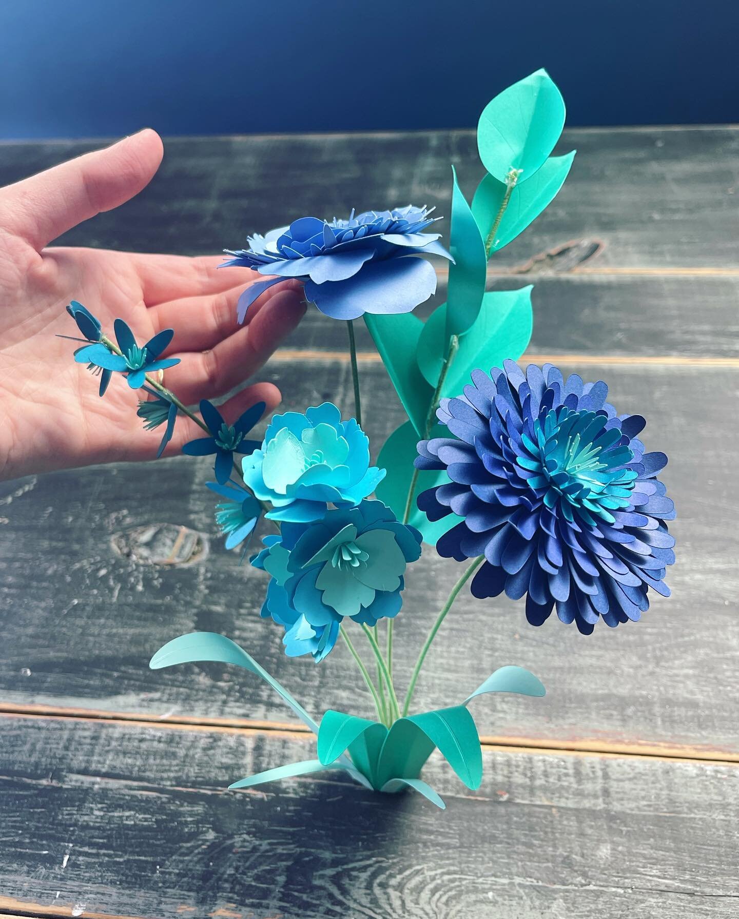 Paper flowers: before and after shooting. My favorite animation technique is reducing something&rsquo;s size until it&rsquo;s 100% gone, then reversing the footage. I rigged these flowers between two wood boards (hidden behind a few large leaves in f