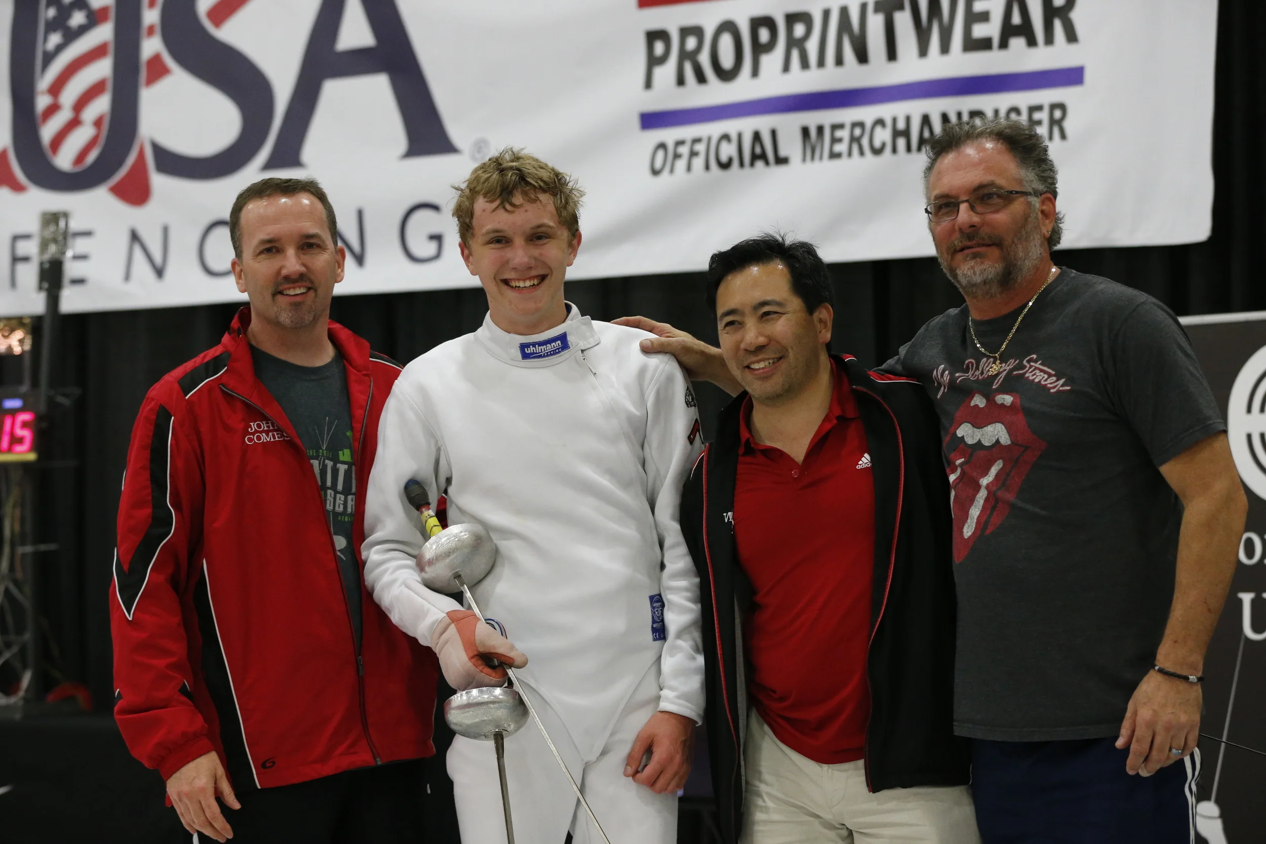 Matthew and members of his WFA support team (L-R): Proud dad John Comes, (Matthew), coach Kevin Mar, and senior coach Bill Becker.
