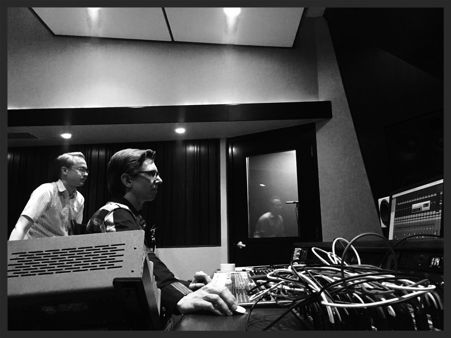 G Burns Jug Band's Clint Davis and engineer Chris Hobson intently listening back to another keeper at Rarefied.