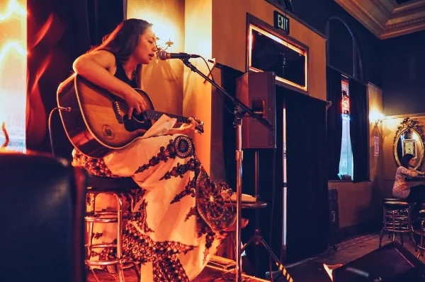 Artist Celeste Byers, known to many for her murals all around the world, shared her exceptional singing and guitar talents at the Black Cat Bar acoustic evening. Photo: Nick Lane