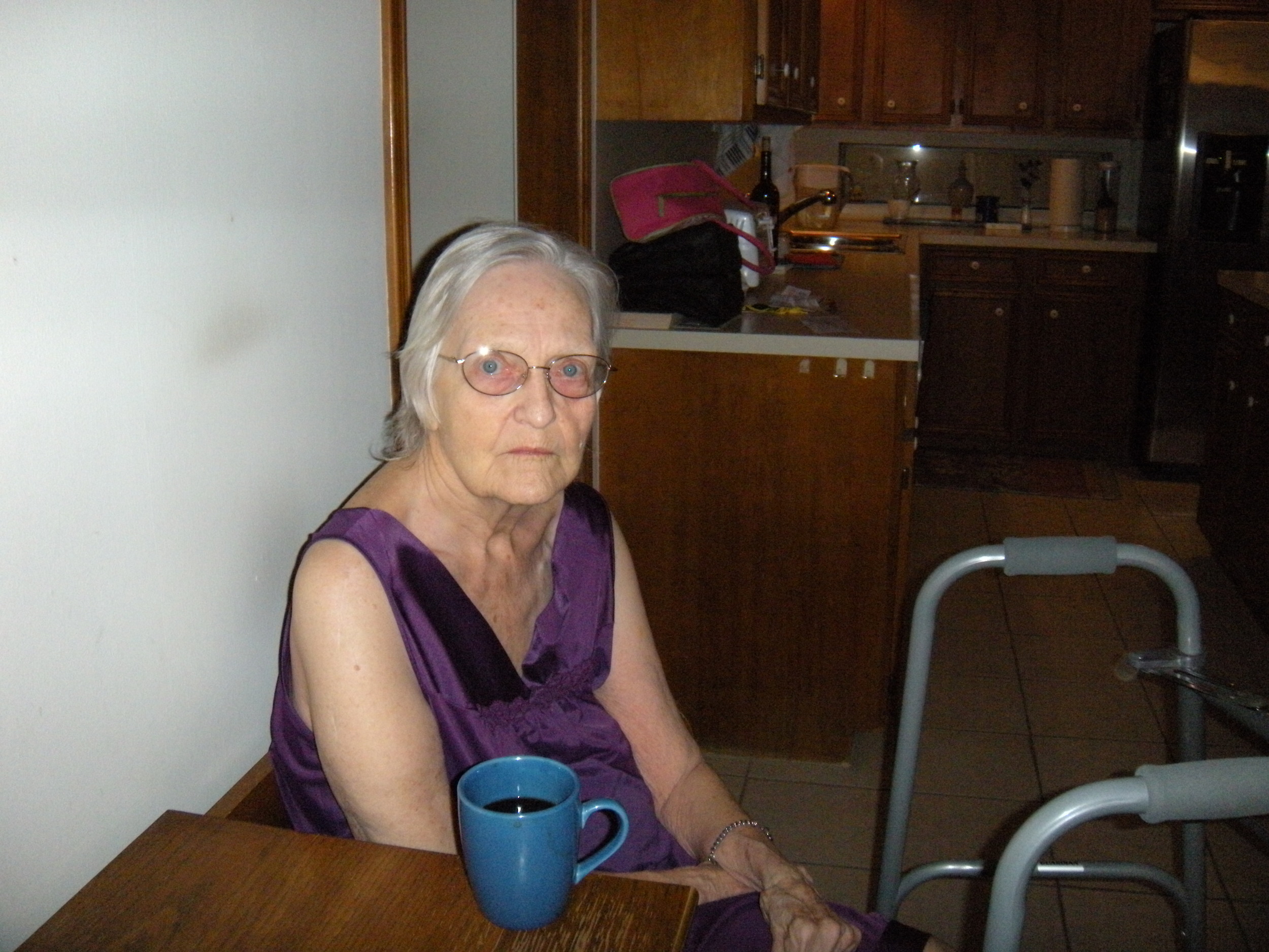 Momma and her coffee. The corked wine in the background is mine.