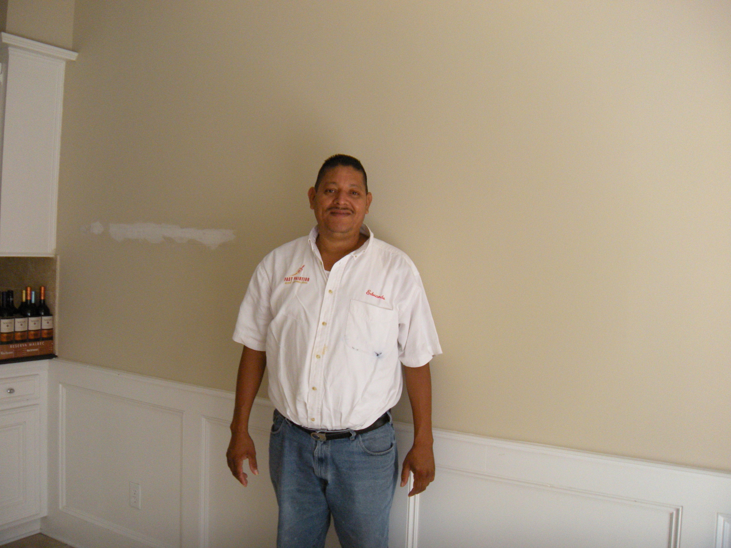 Eduardo, our contractor. His company is called Fast Paint, but he does more than paint. Works hard and does a good job. Honest and polite crew. The wine on the counter is mine. 