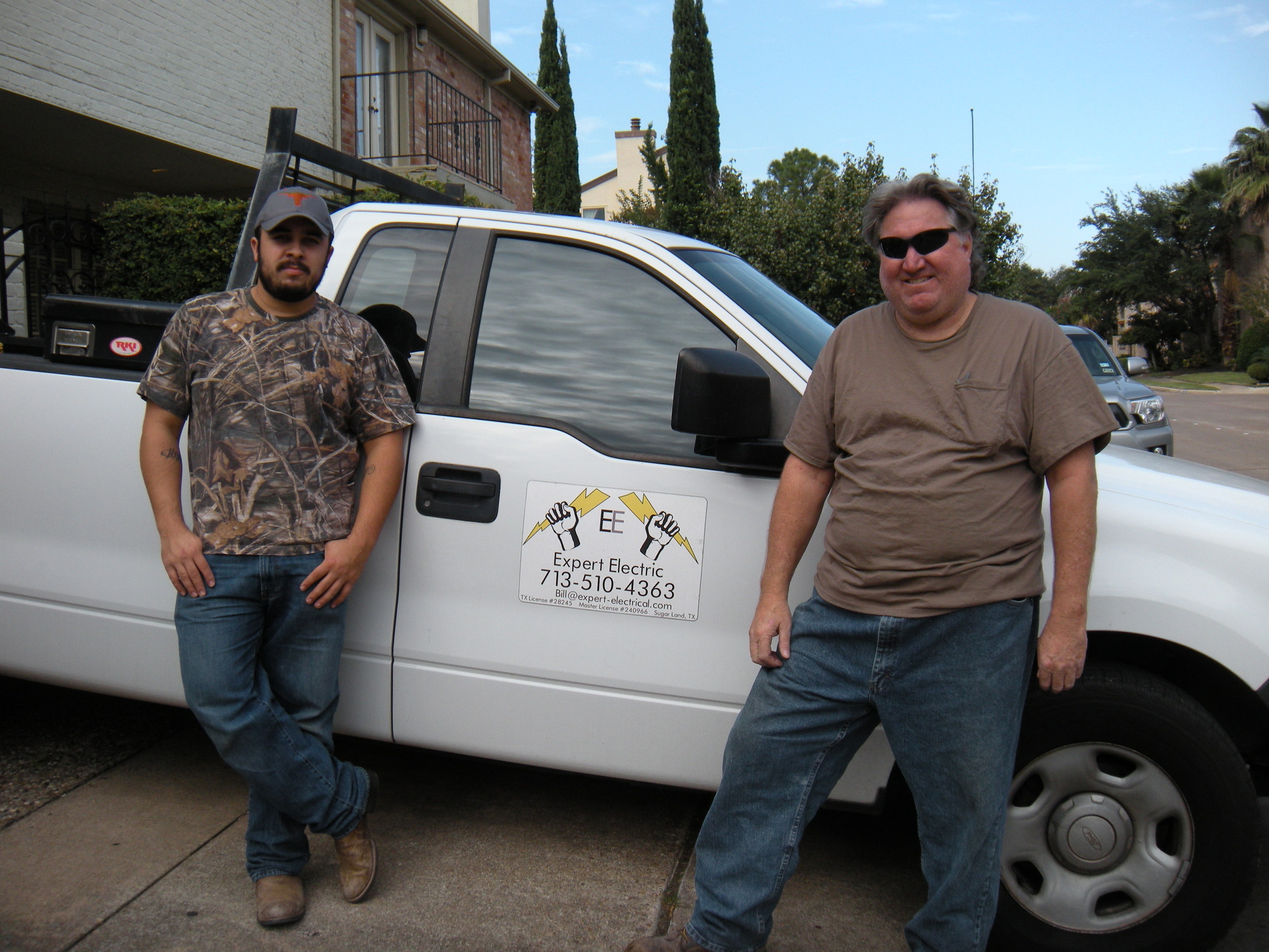 Bill and his buddy. Bill's the one on the right. See his phone number? You can call him and he'll come change out your fuse box. 