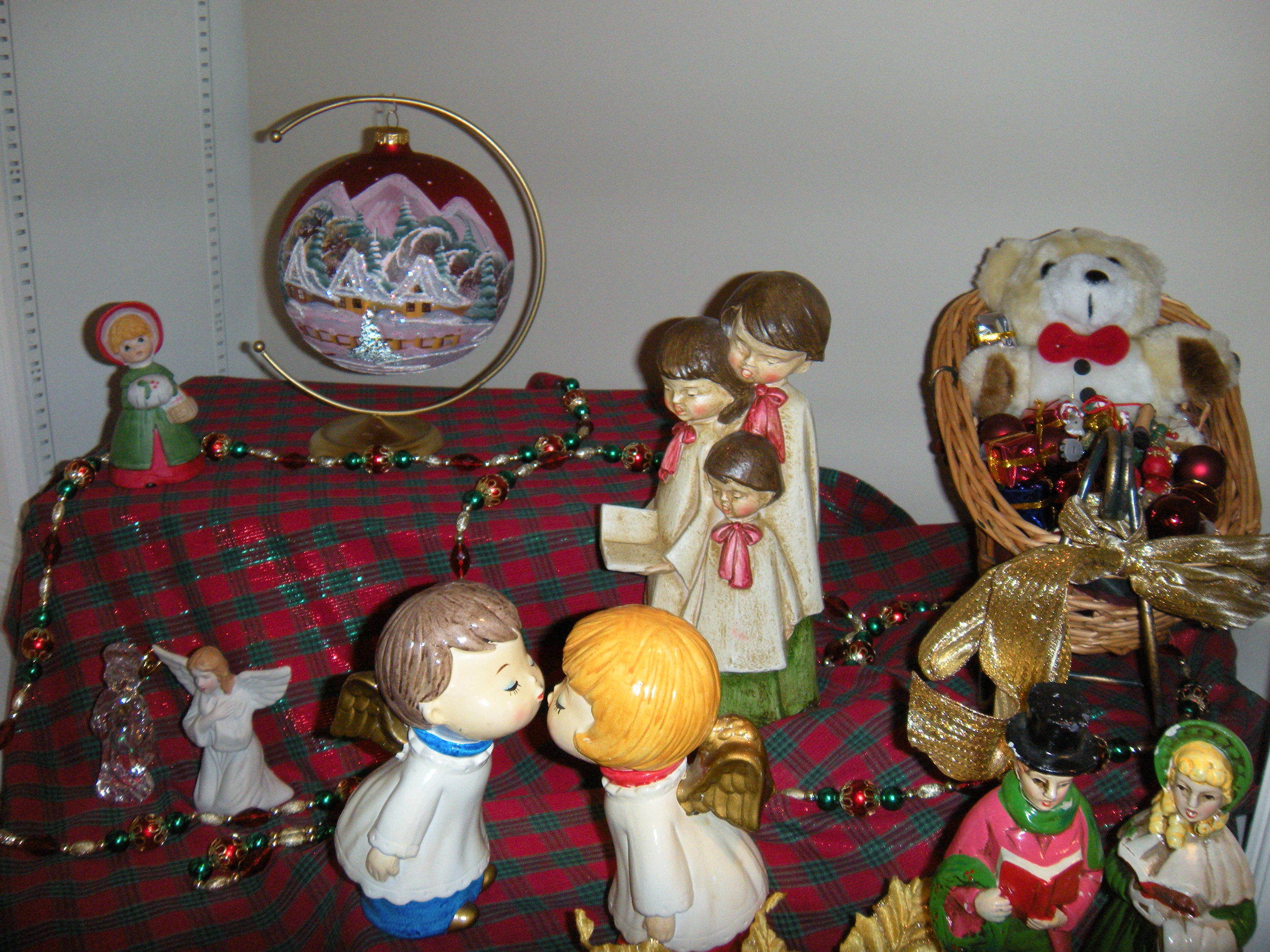 The carolers and kissing angels are very old. They belonged to my mother's second husband's first wife. . 