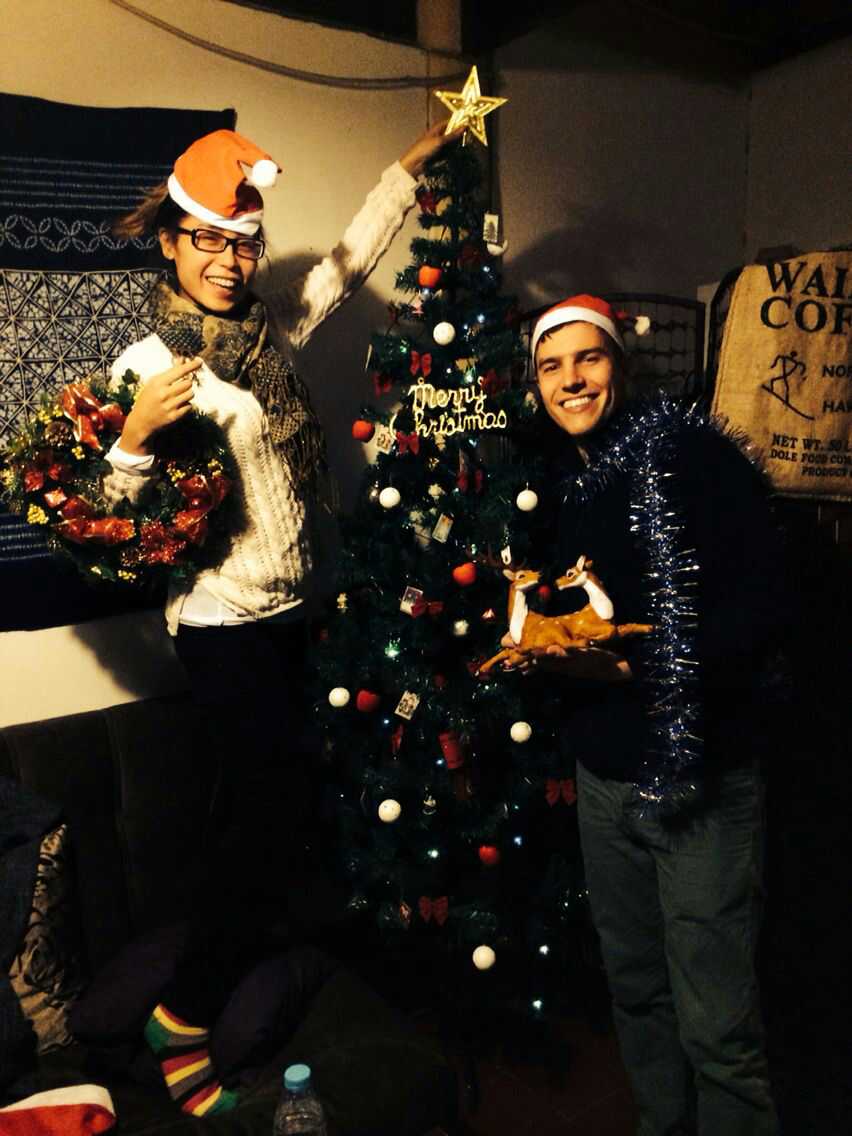 This is Sam and Julia's Christmas photo. I can't tell if the deer are on Sam's shirt or if he's holding them in his hands.