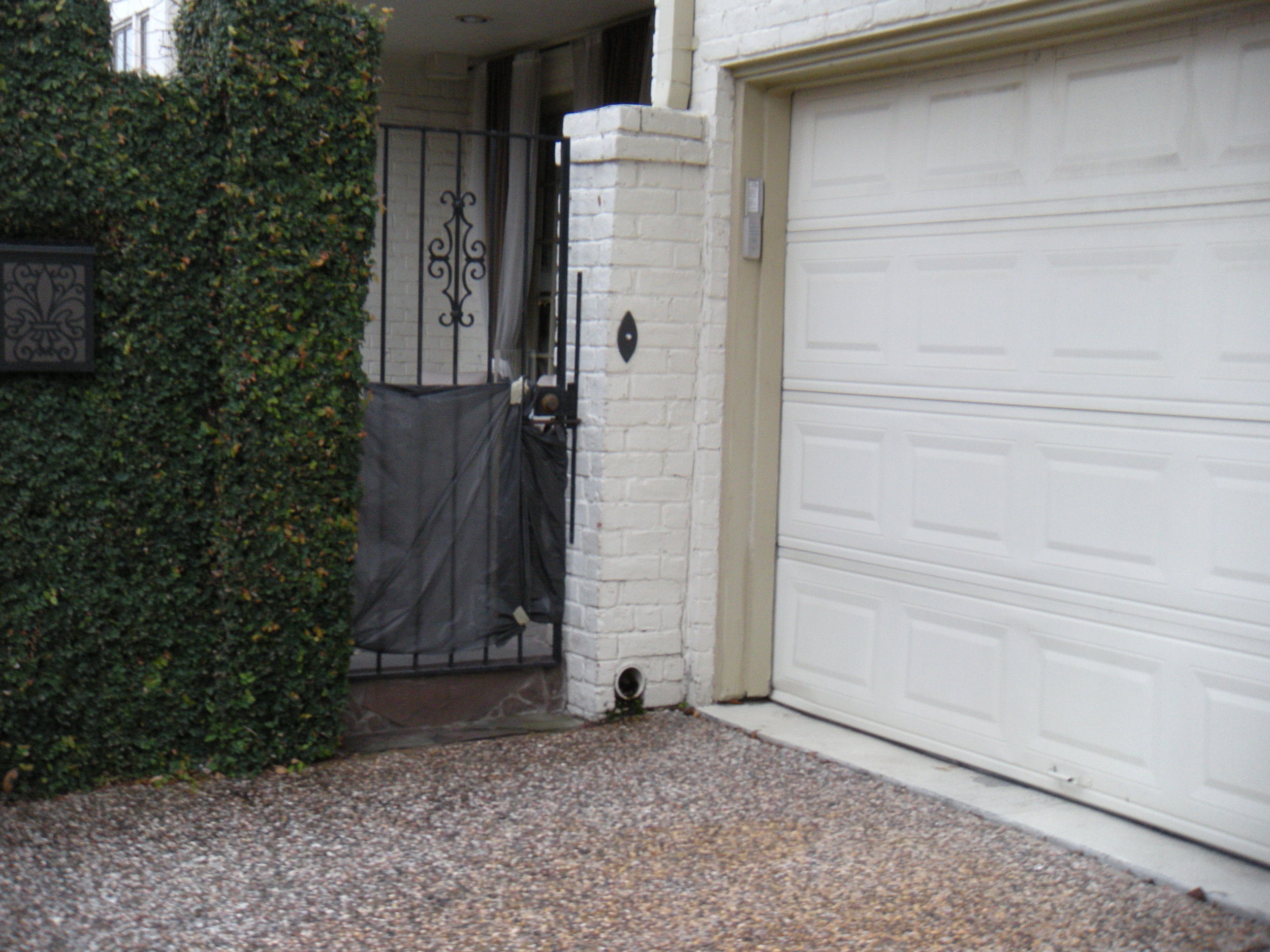 Though the dog is gone, the taped-up plastic sheeting remains. Tacky, right? 