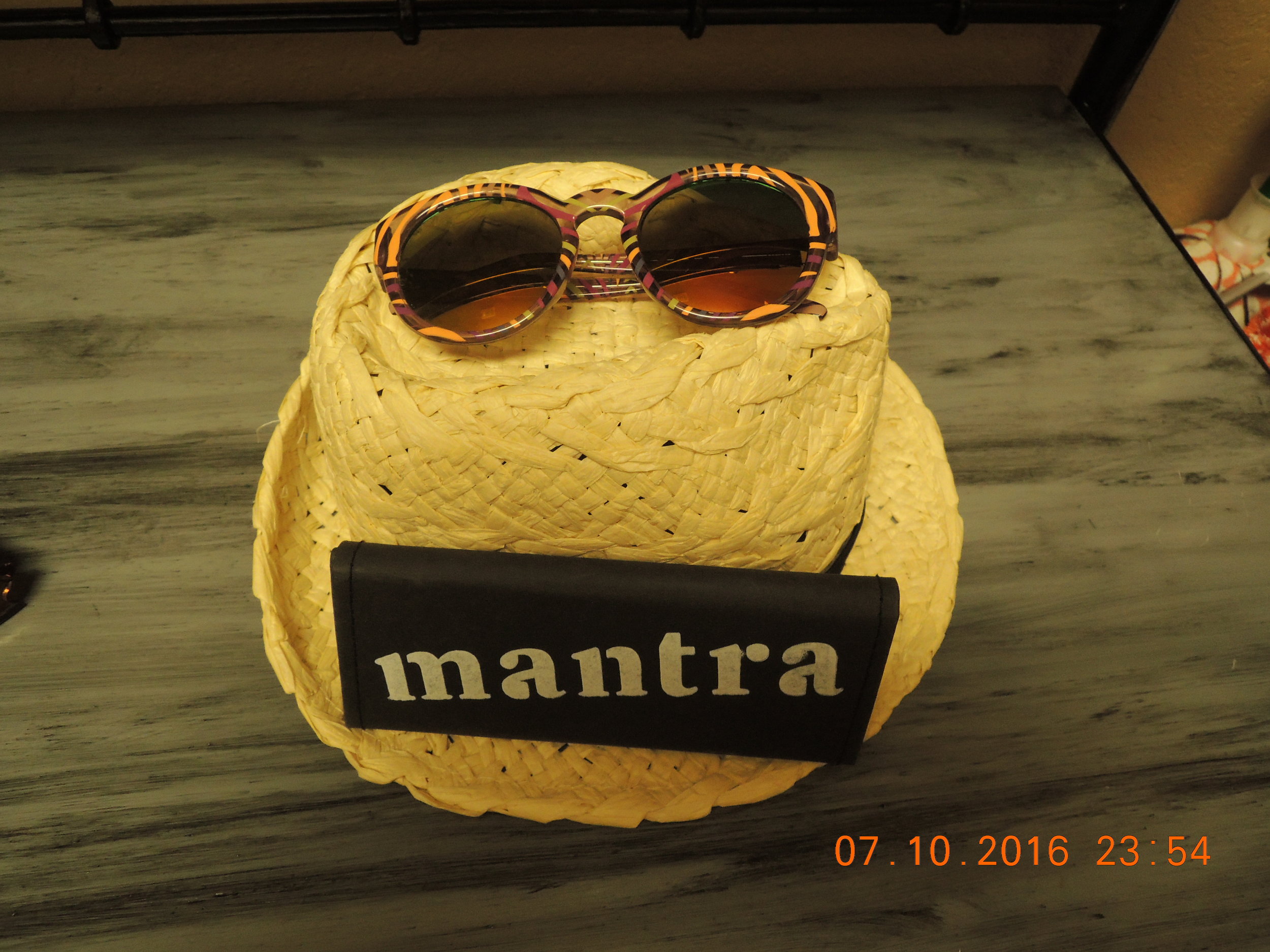 I made an advertising tableau of the sunglasses Sam gave me. The lenses are polarized and mirrored. I like mirrored lenses because people can't tell that I'm asleep. 