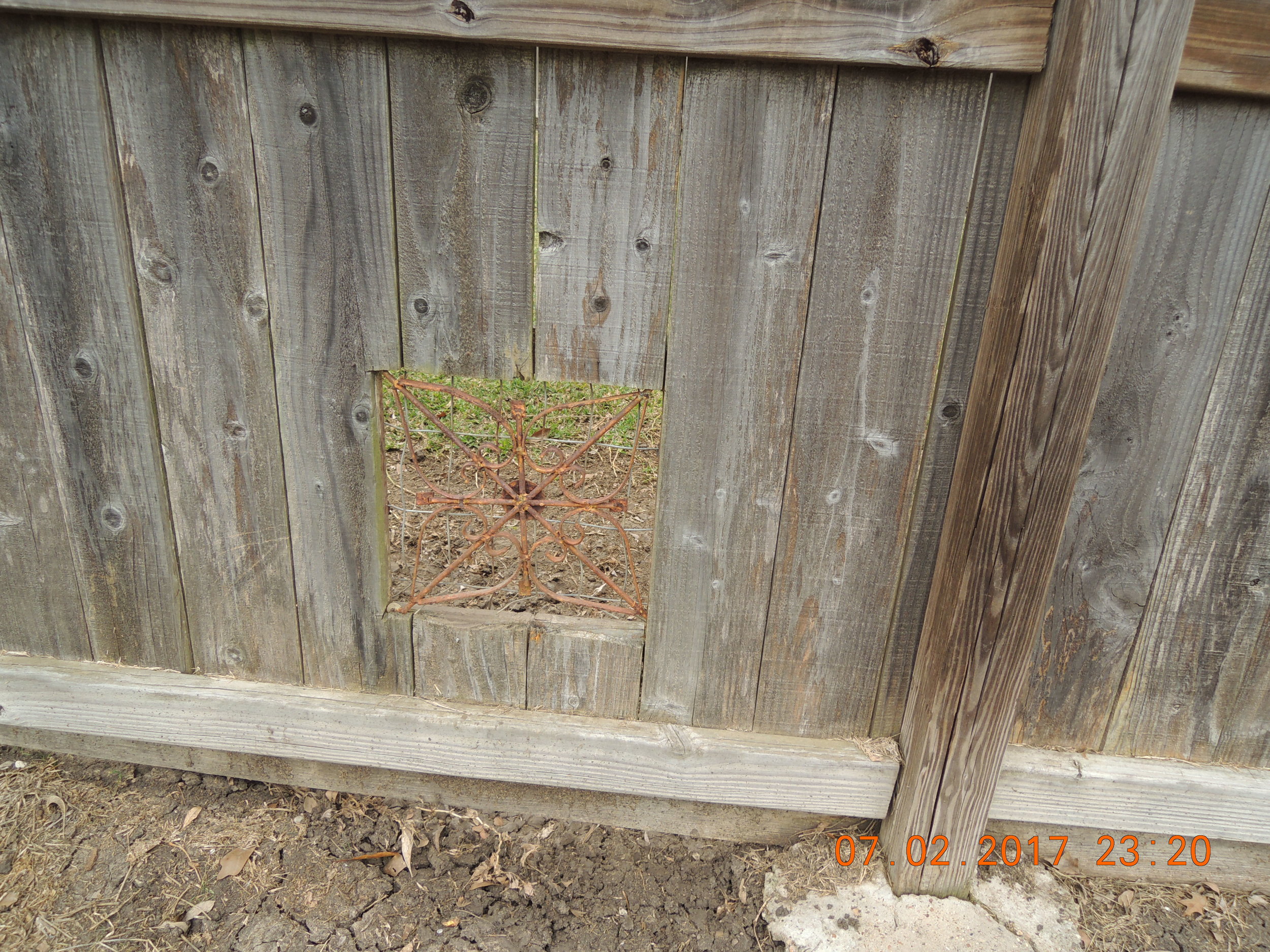It's kind of dog owners to have these screens built into their fences. Dogs need to be entertained. 