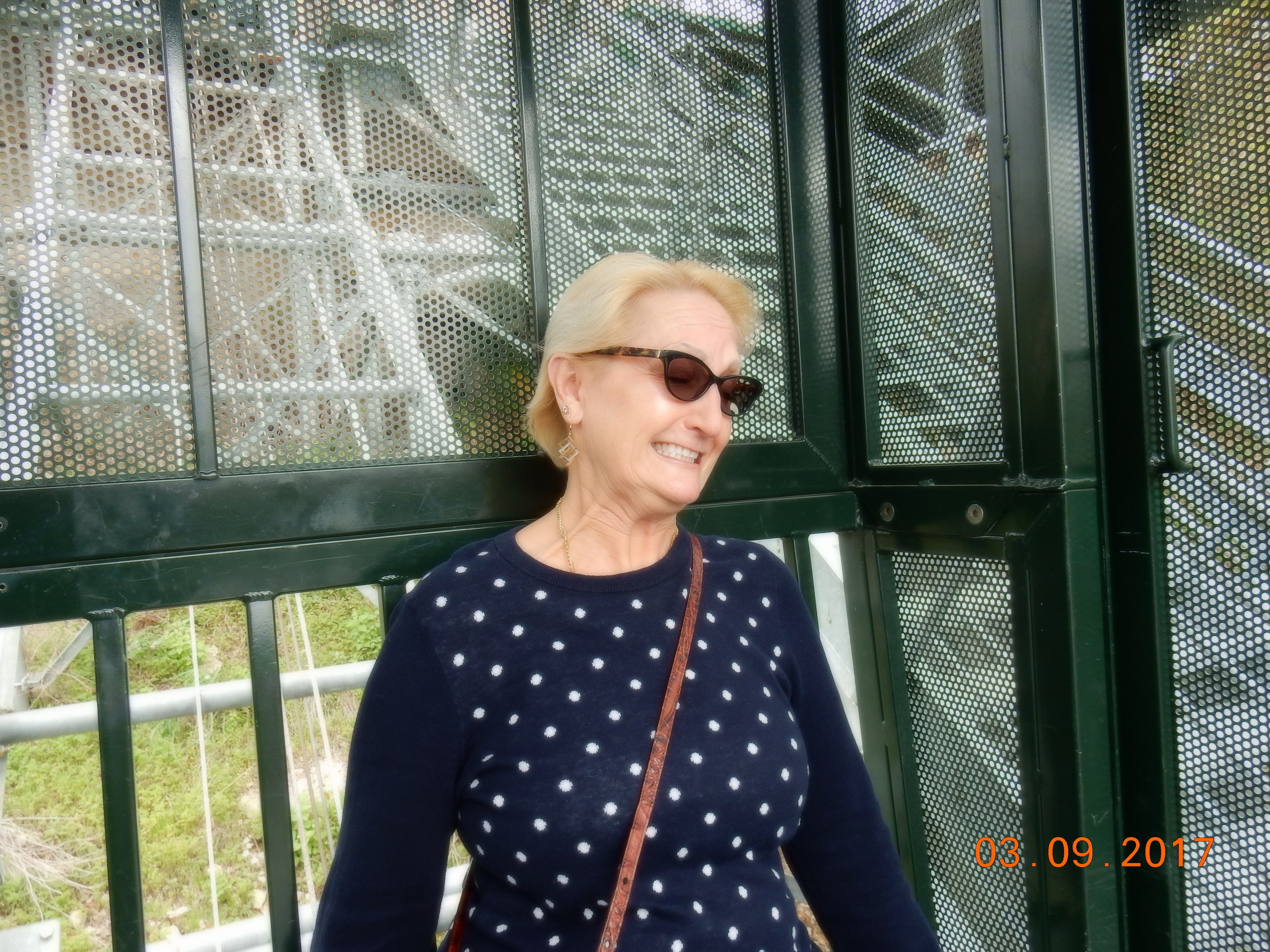 This is me, terrified with eyes closed as we descend. The sweater makes me look fatter than I am--won't be wearing that again! 