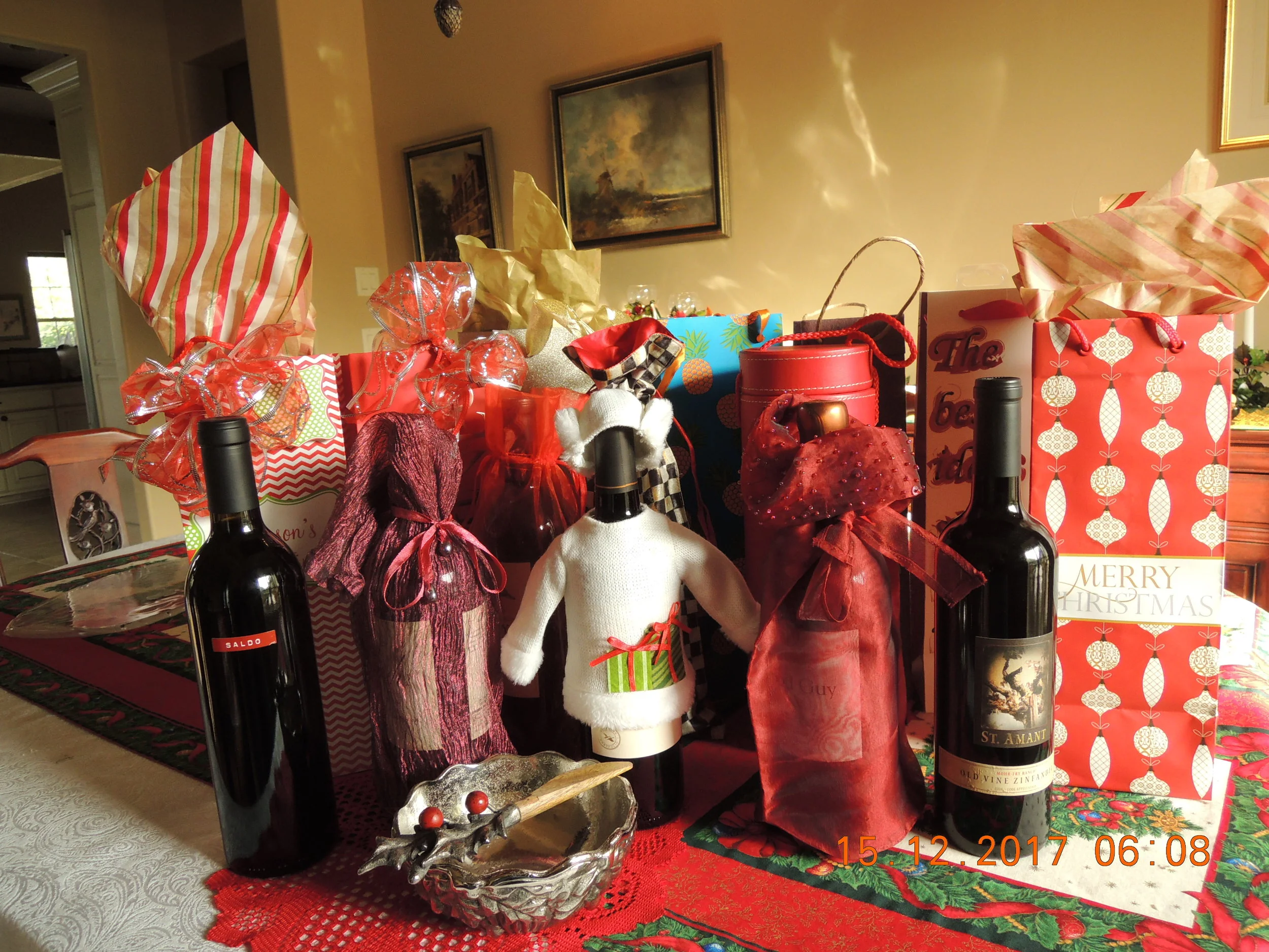 Every one of these gift bags holds a bottle of red wine, given to us by people who came to the open house. I guess I've made my preferences known. Thanks, friends. 