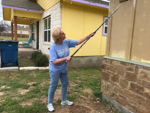 They let me use a roller! The bright colors chosen by the owner of the house behind me caused quite a stir. But I imagine that nice woman is happy in her cheerful yellow house. I call it the Easter egg house.