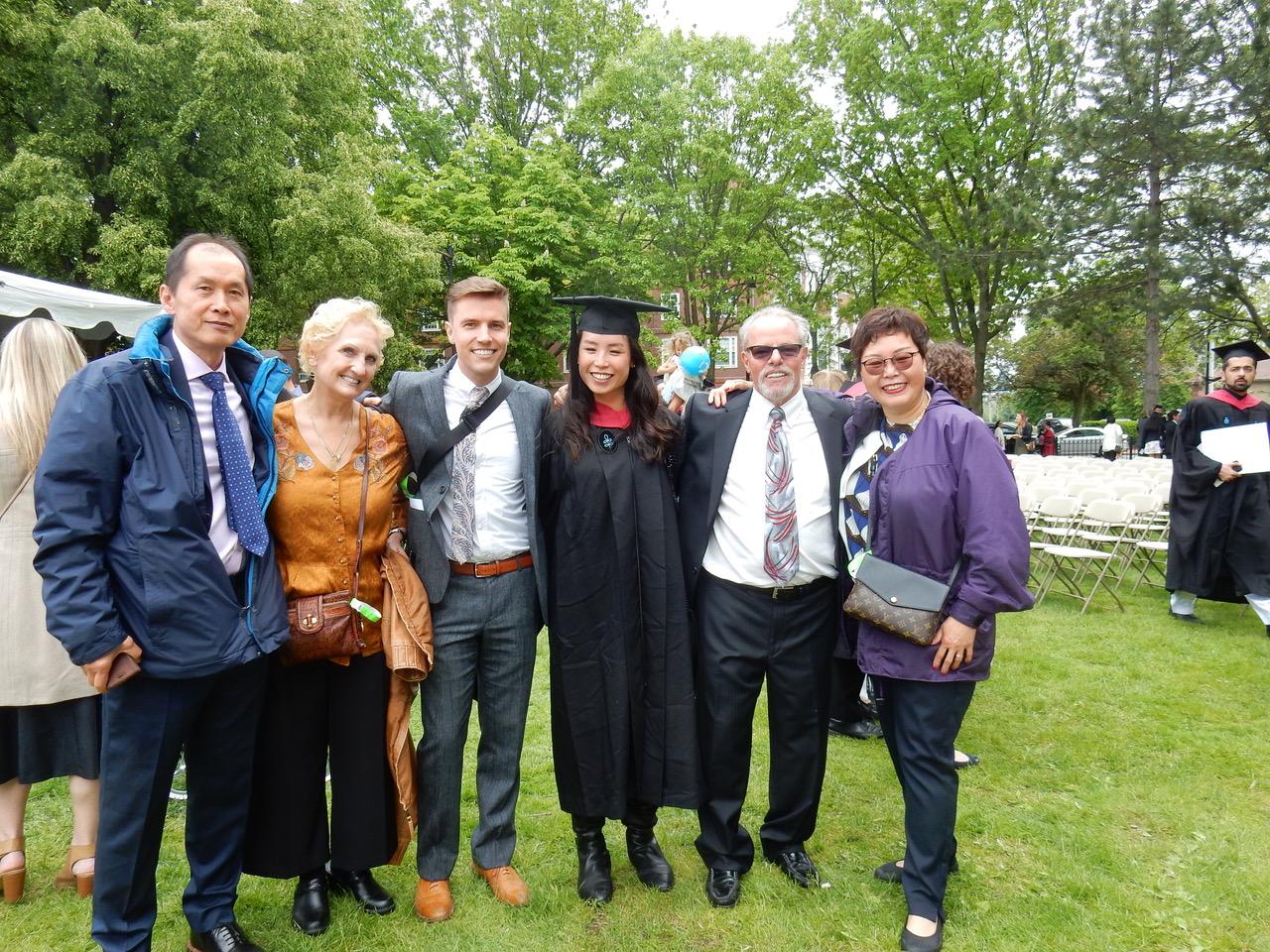 Julia and her parents, Sam and his parents.