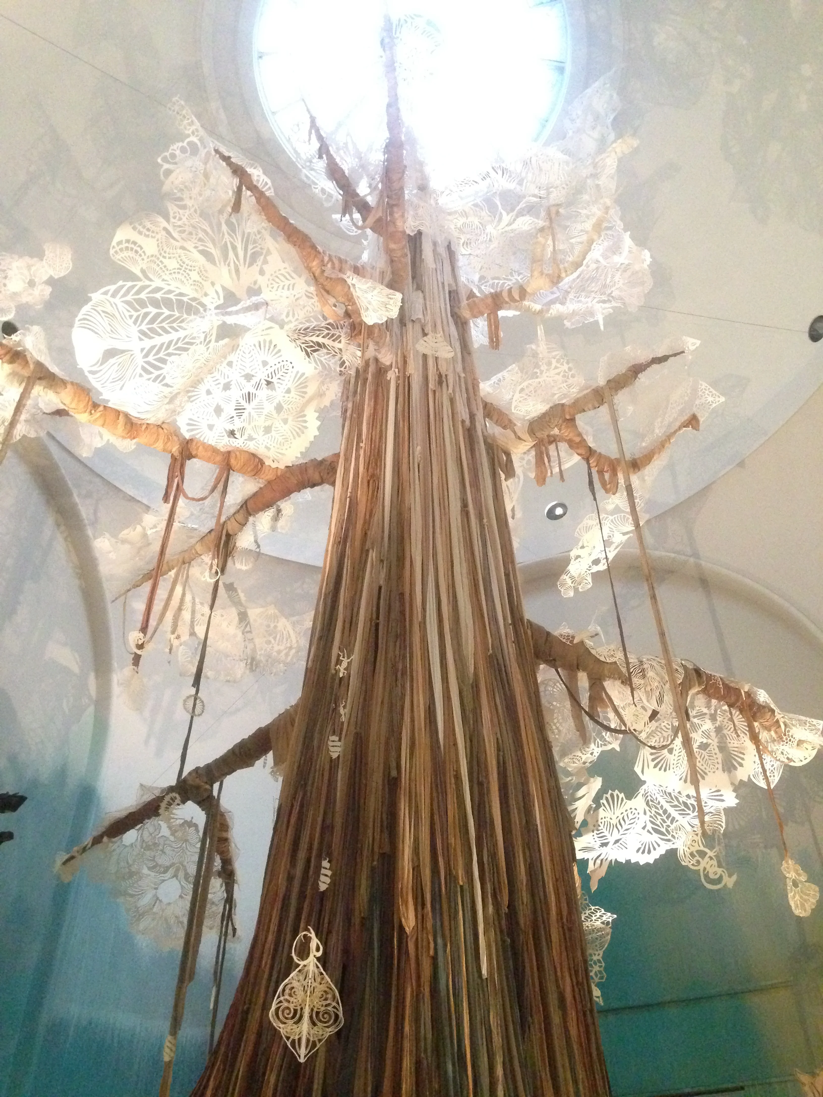 RAG INFUSED TREE TRUNK WITH REFLECTED FORMS BY SWOON