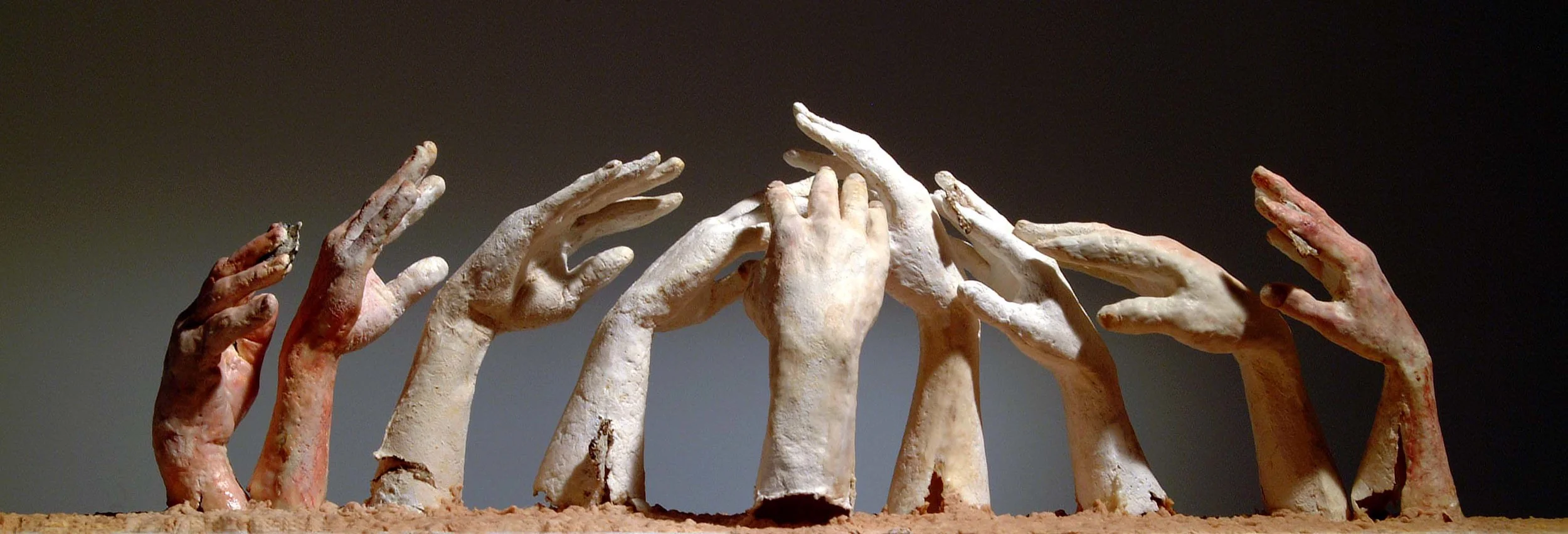 Joan Giordano, Farmers Hands, cast paper, wax, encaustic, pigment, 55” x 116” x 12”