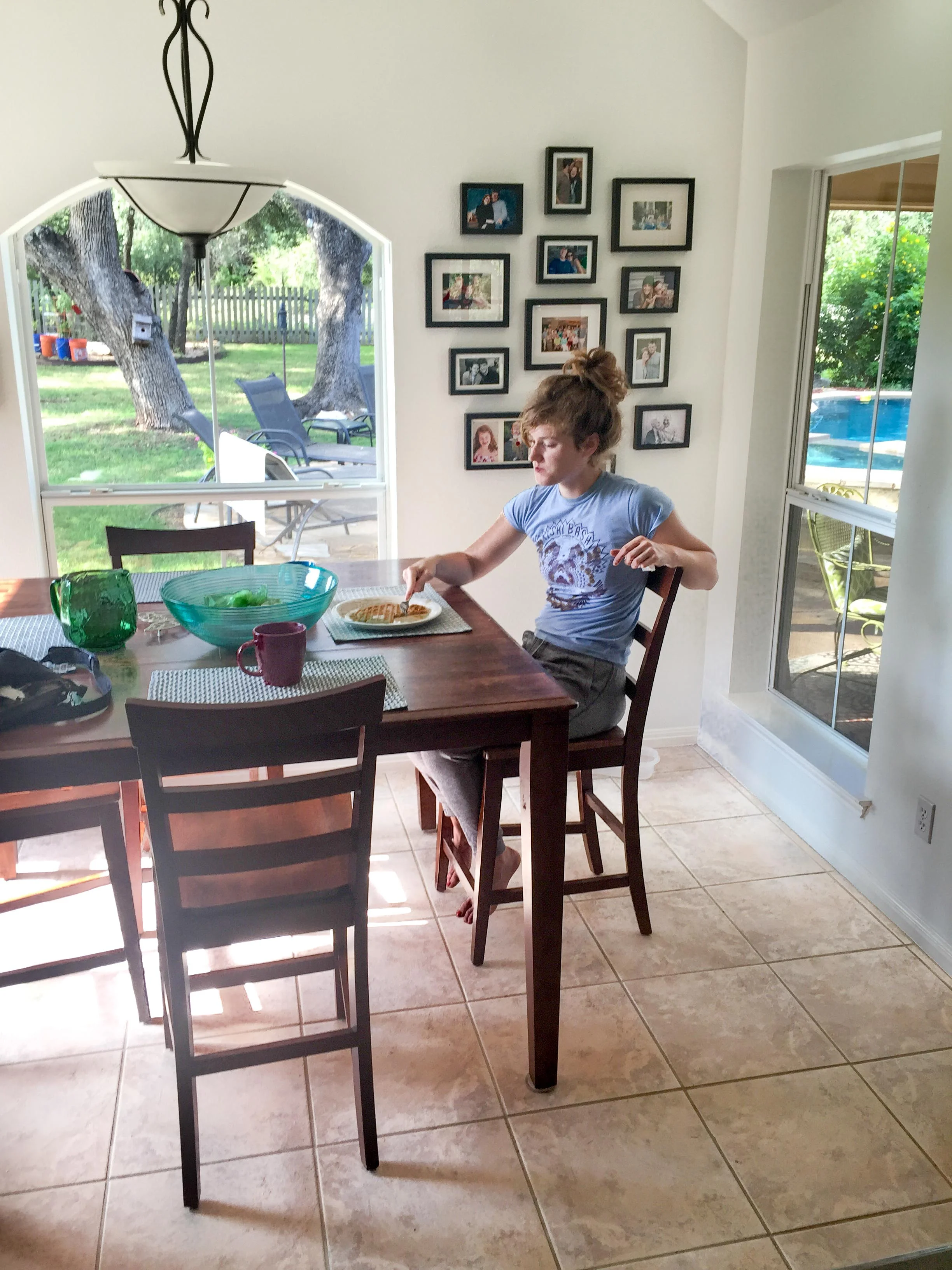 My girl, sitting at my breakfast table for the very last time before hitting the road. I deeply wished for a pause button.