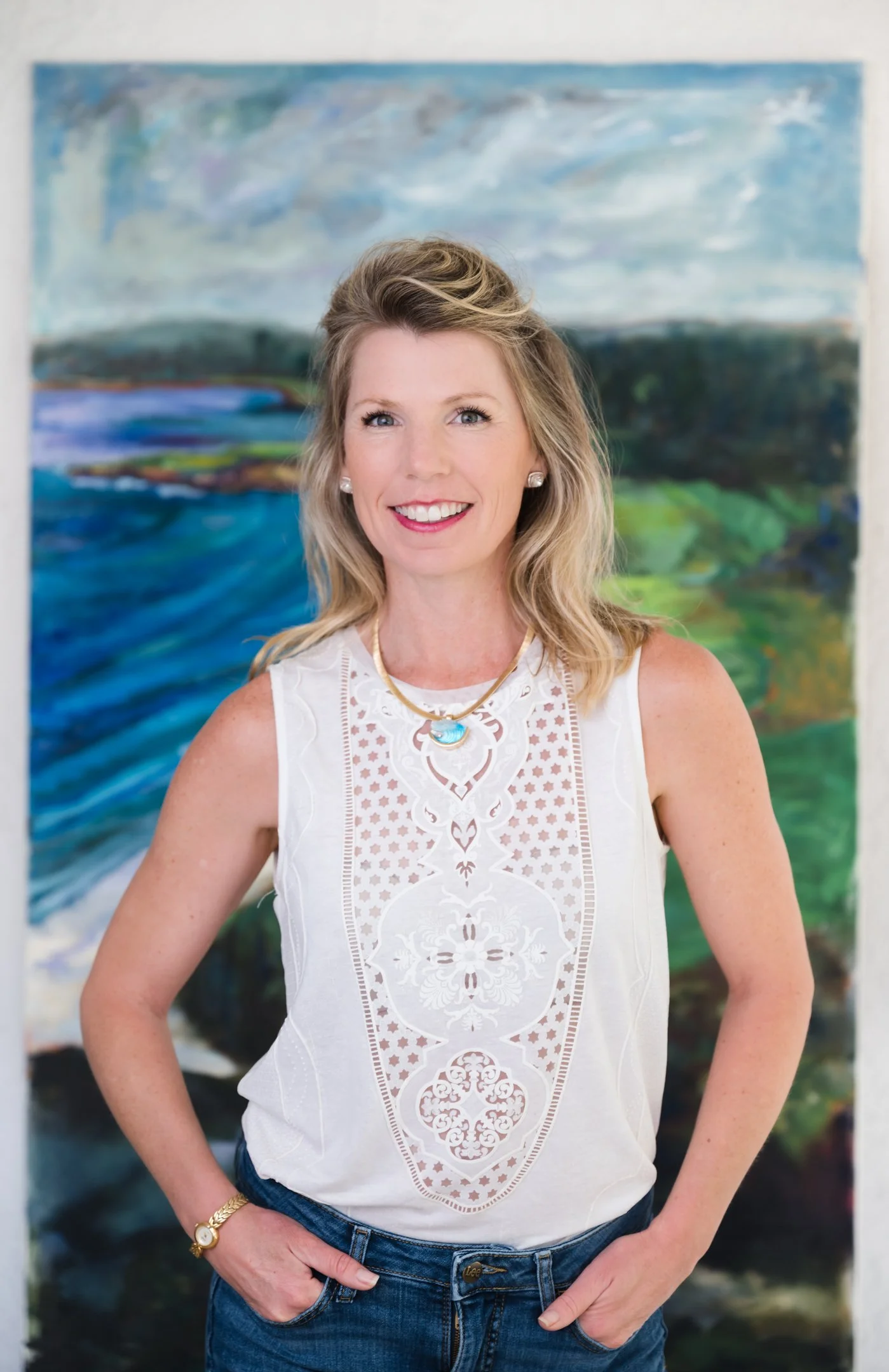 A woman with blonde, wavy hair, wearing a sleeveless white blouse with intricate embroidered patterns, Alisha Mowry Photography Military, Brand, and Portrait Photographer San Diego CA