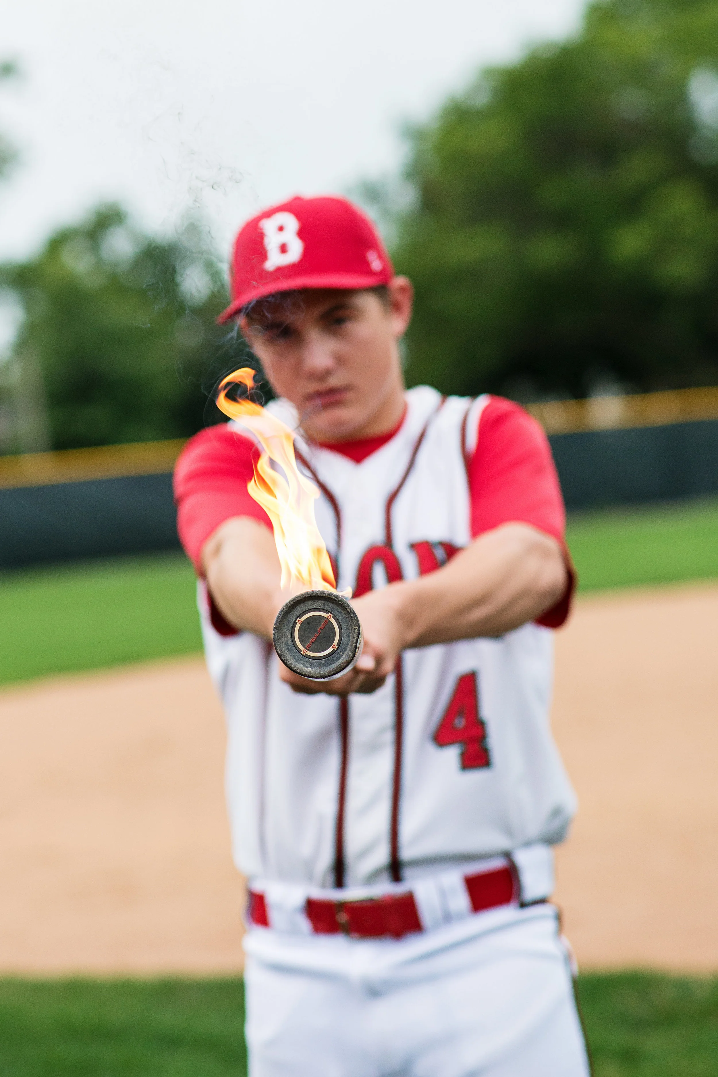 Senior Photo Poses - baseball bat on fire