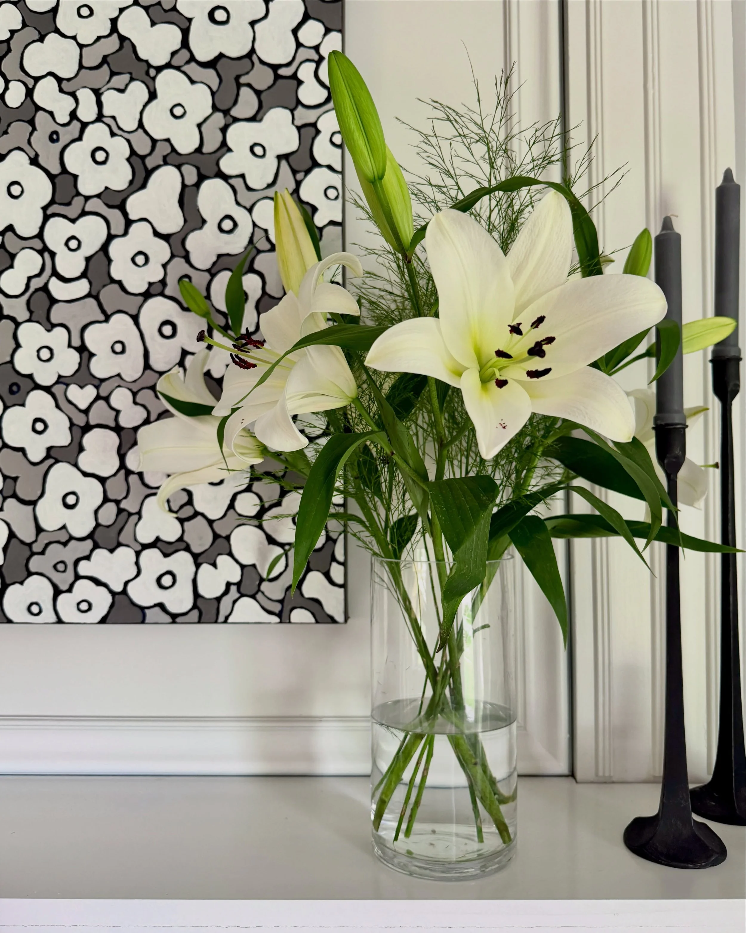ON DISPLAY: I do not share many images from my home collection, but with these flowers blooming next to &ldquo;Flowers in Gray and White,&rdquo; it was simply too beautiful not to share. I always love those unexpected moments when life and art begin 