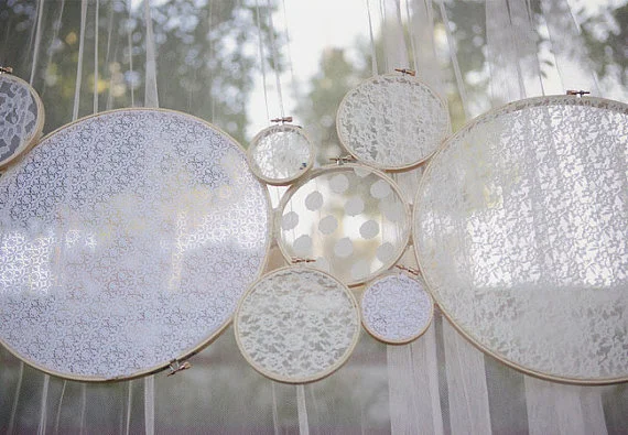 {Via} These handmade lace circles are great for any ceremony space, bridal shower, baby shower, or even a girl's birthday party. Change up the colors to put a more modern twist on the decor!
