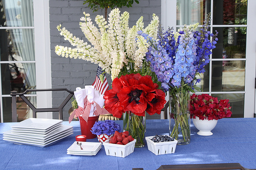 {Via} A more elegant look for your Fourth of July festivities are floral arrangements. These are not only patriotic in the color scheme but also in the sense that they resemble fireworks themselves!