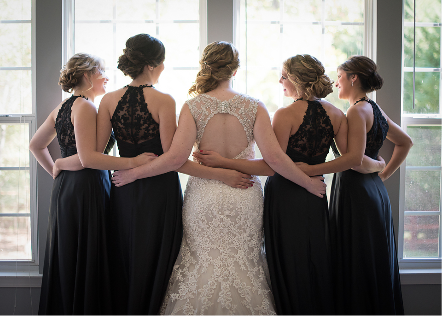 Choose a simple color and cut and focus on the back! These beautiful dresses have a zip-up lacy back that the guests can see when your bridesmaids are standing up at the alter and walking down the aisle. 
